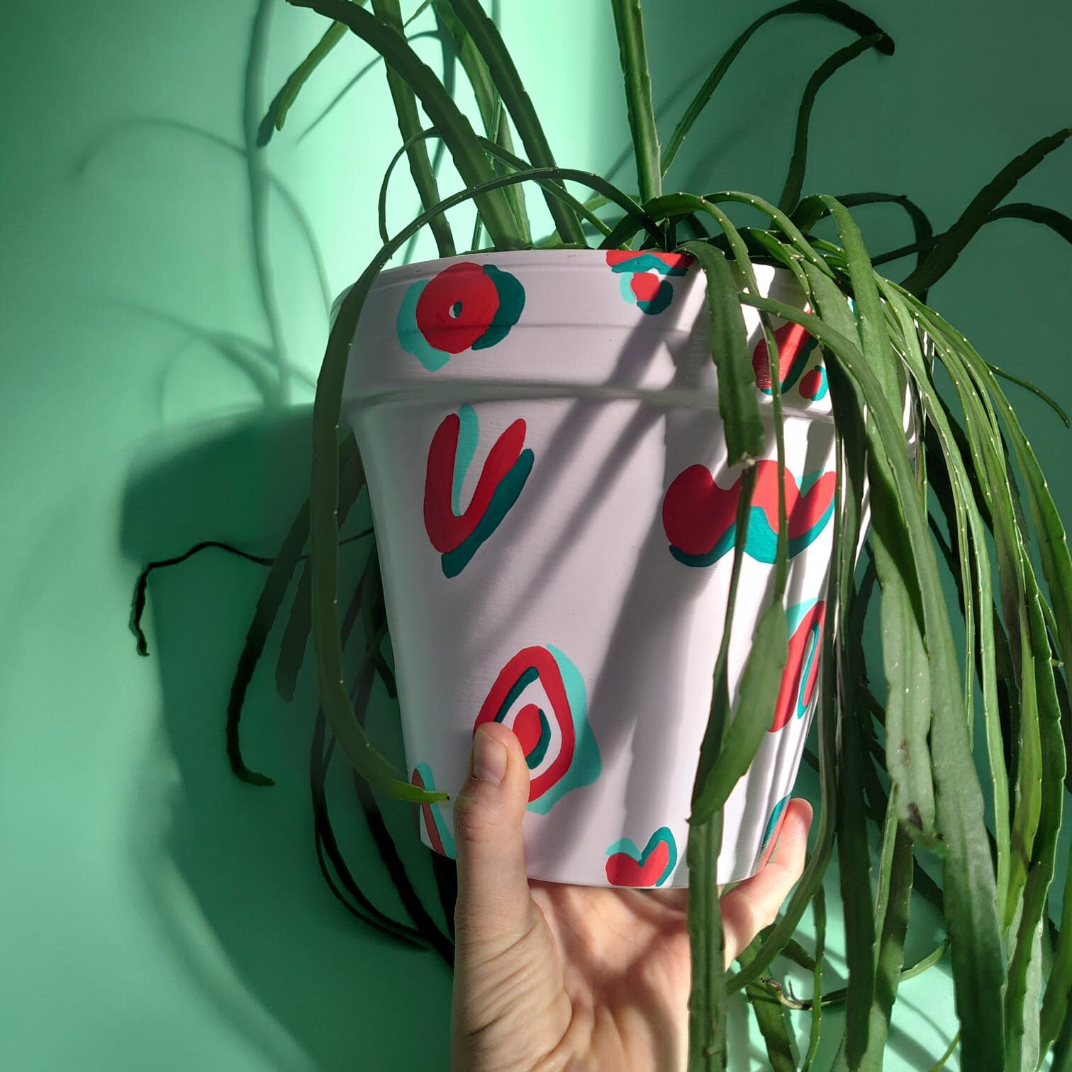 large pink and red plant pot