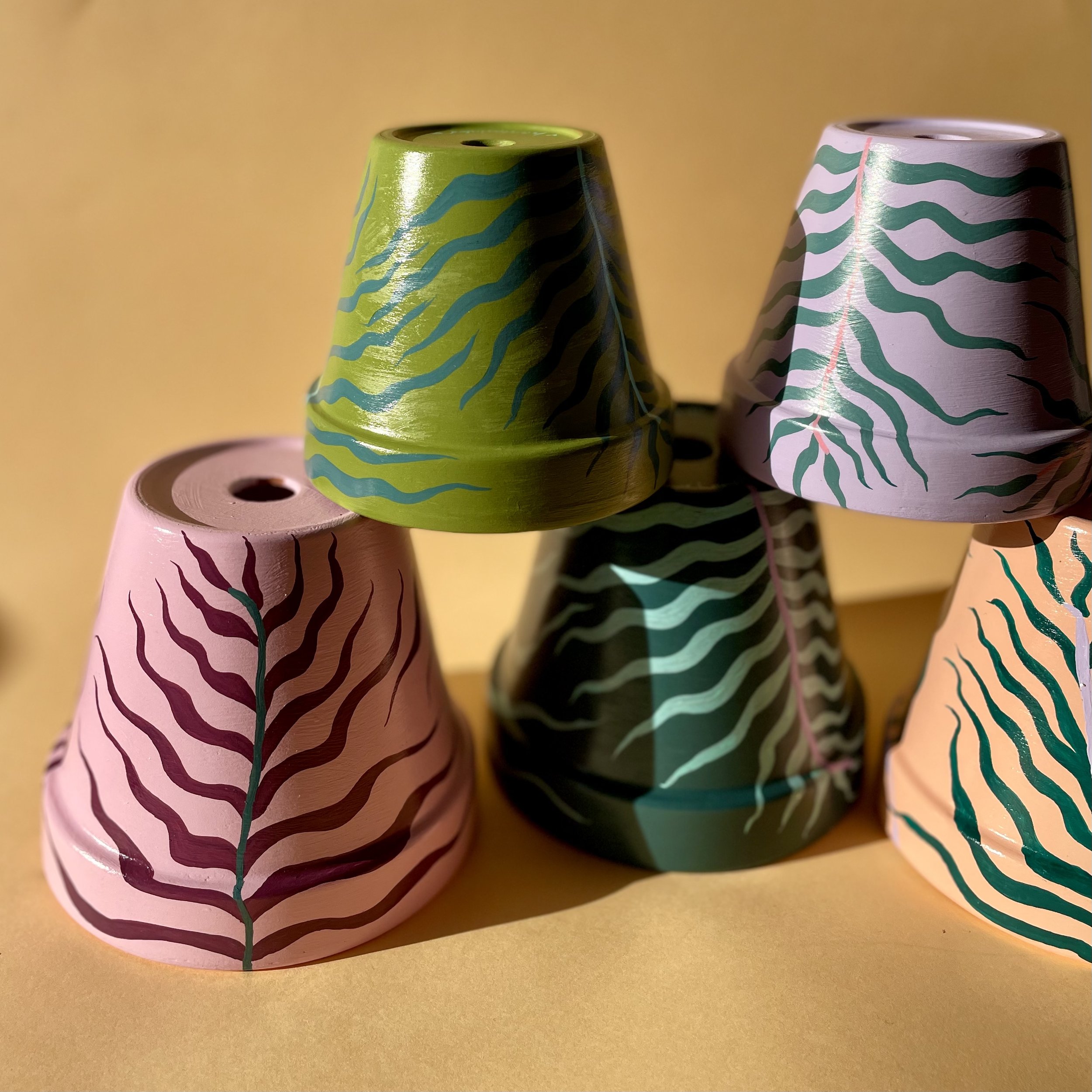 pink, green and lilac plant pots