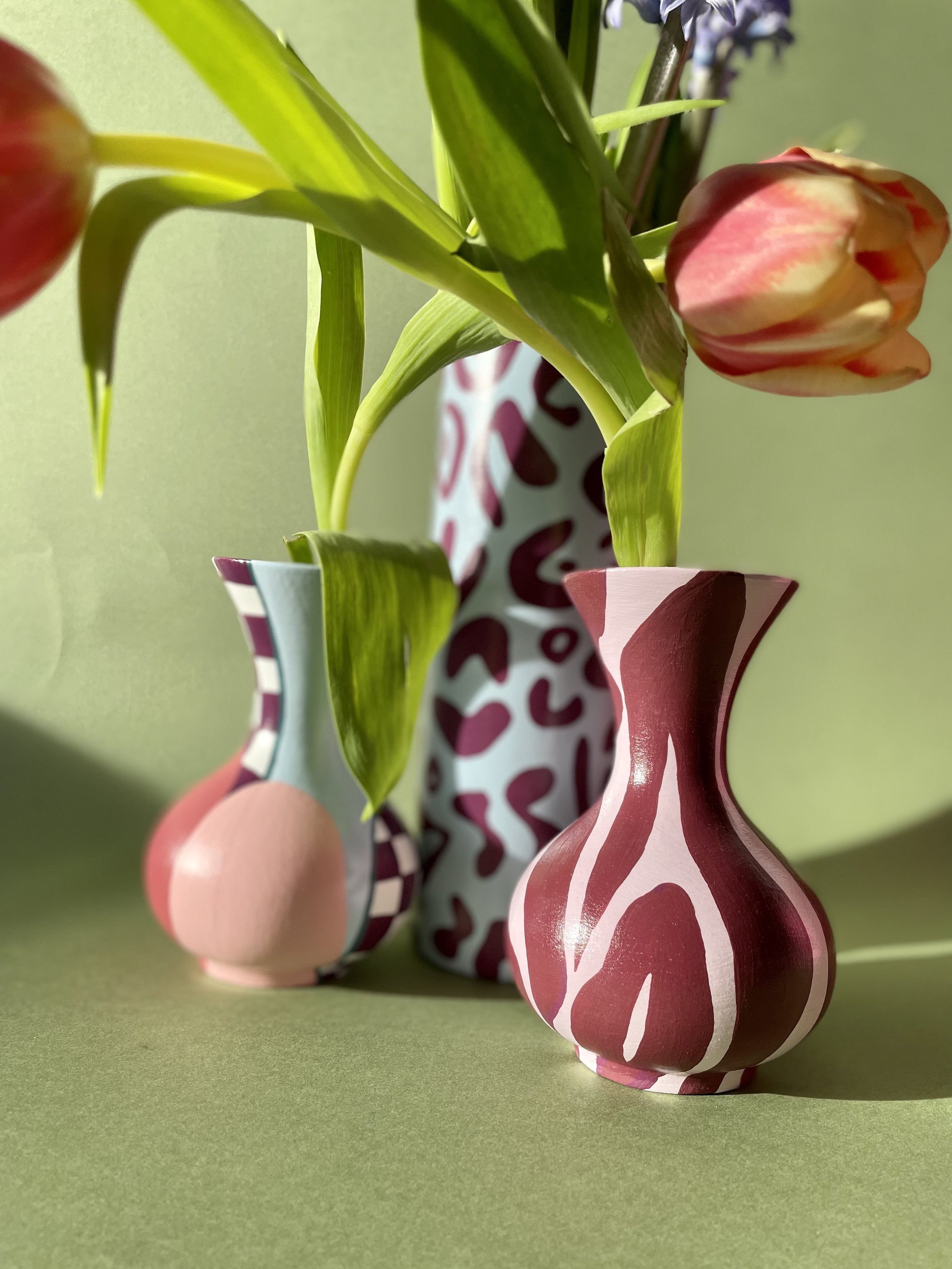 pink and sky blue vases with tulips