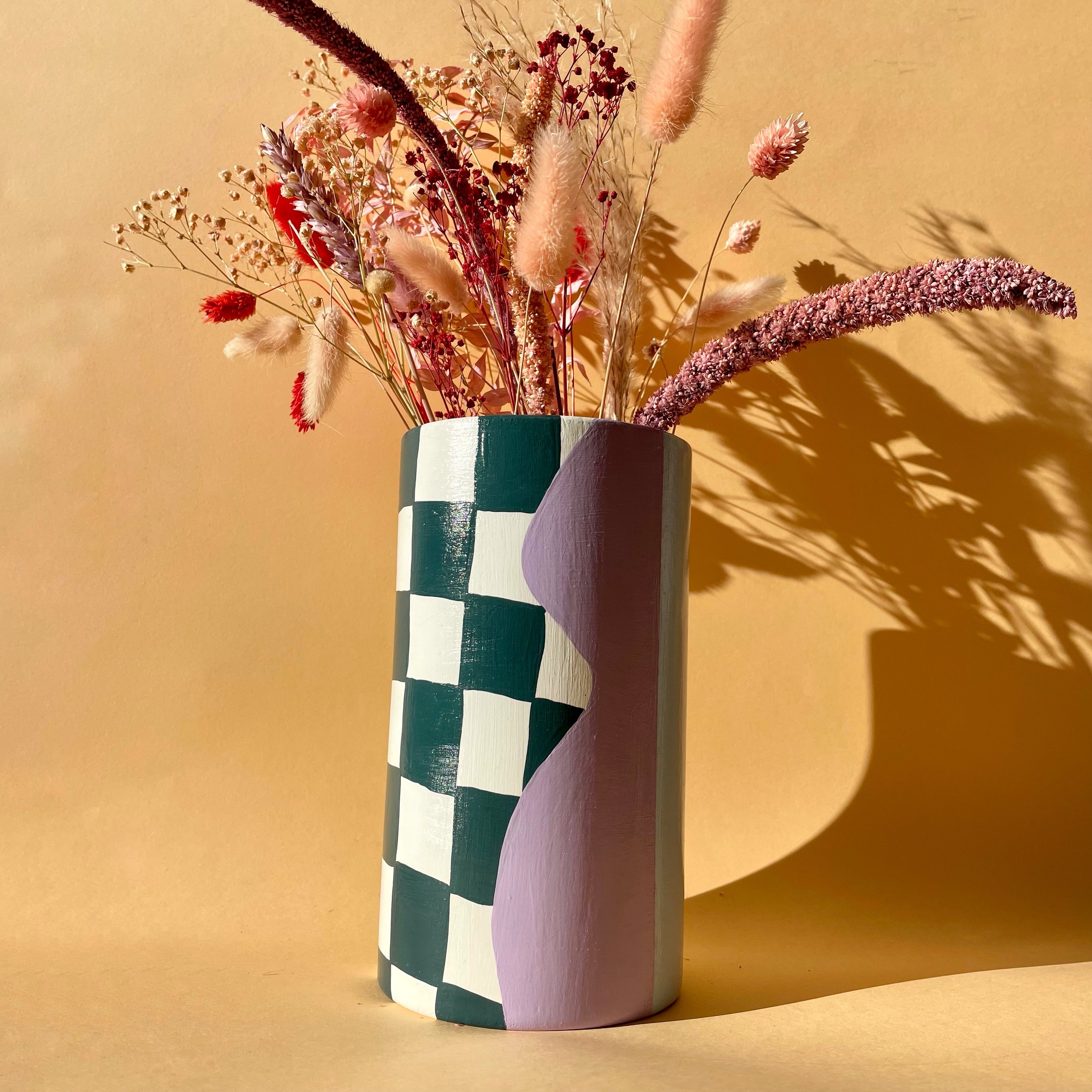 large cylinder vase with dried flowers