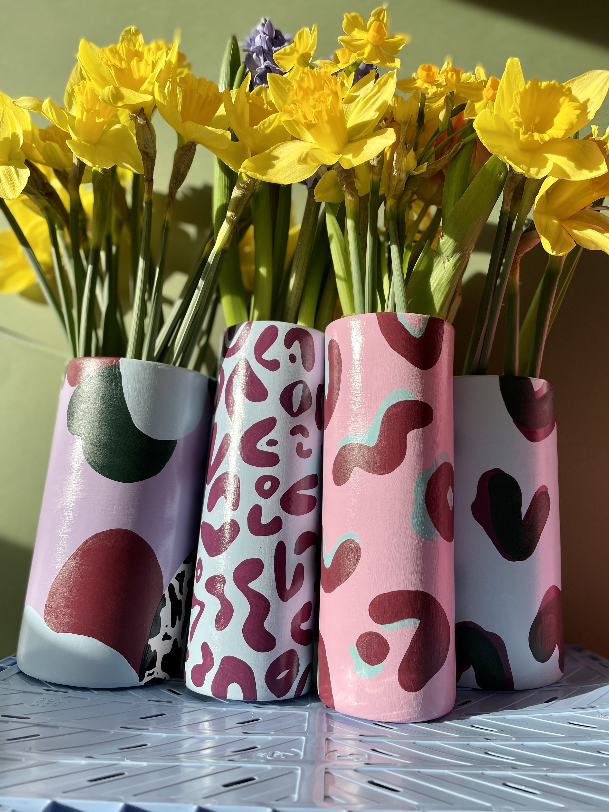 daffodils in ceramic vases