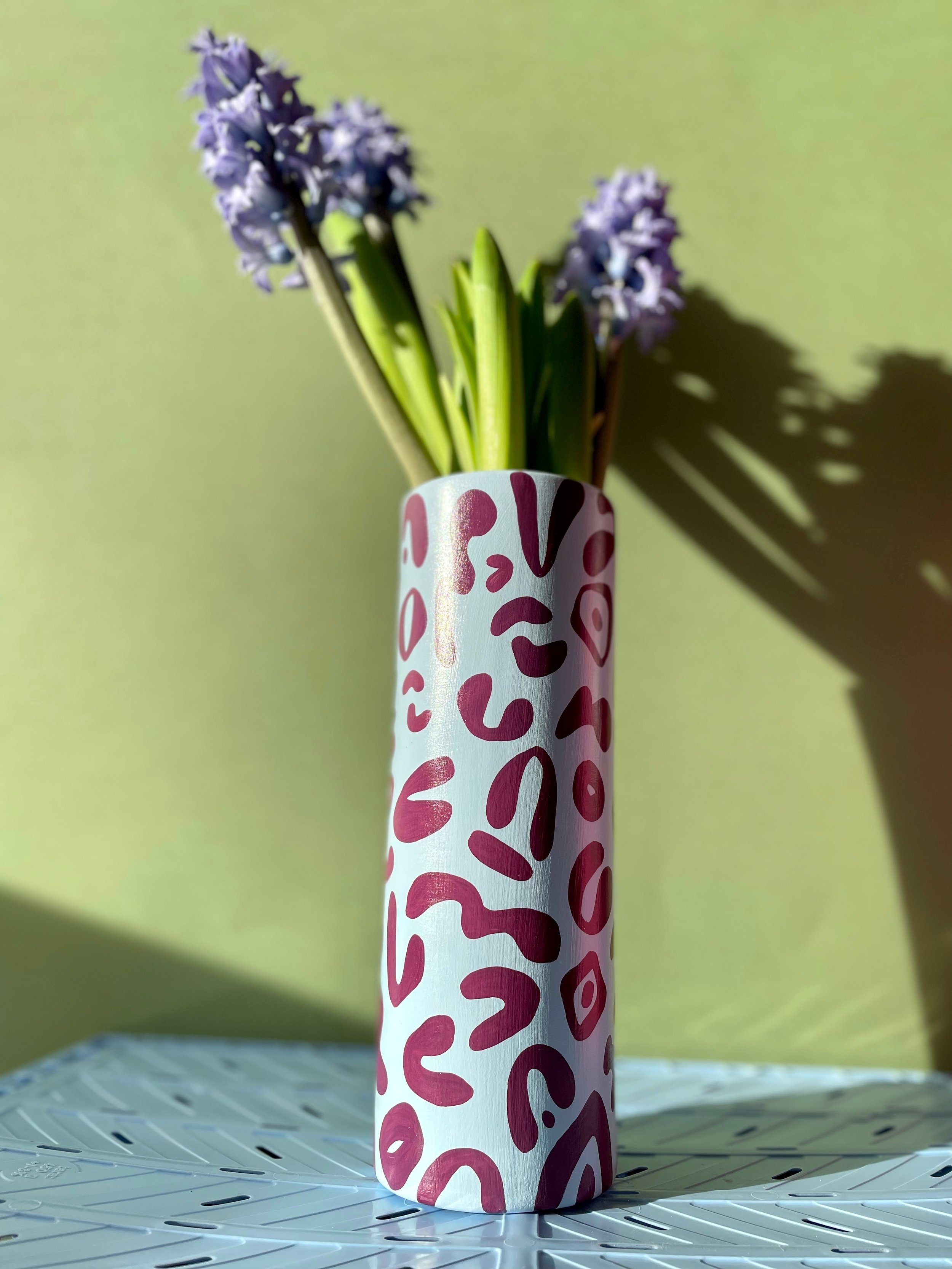leopard print ceramic vase with fresh spring flowers