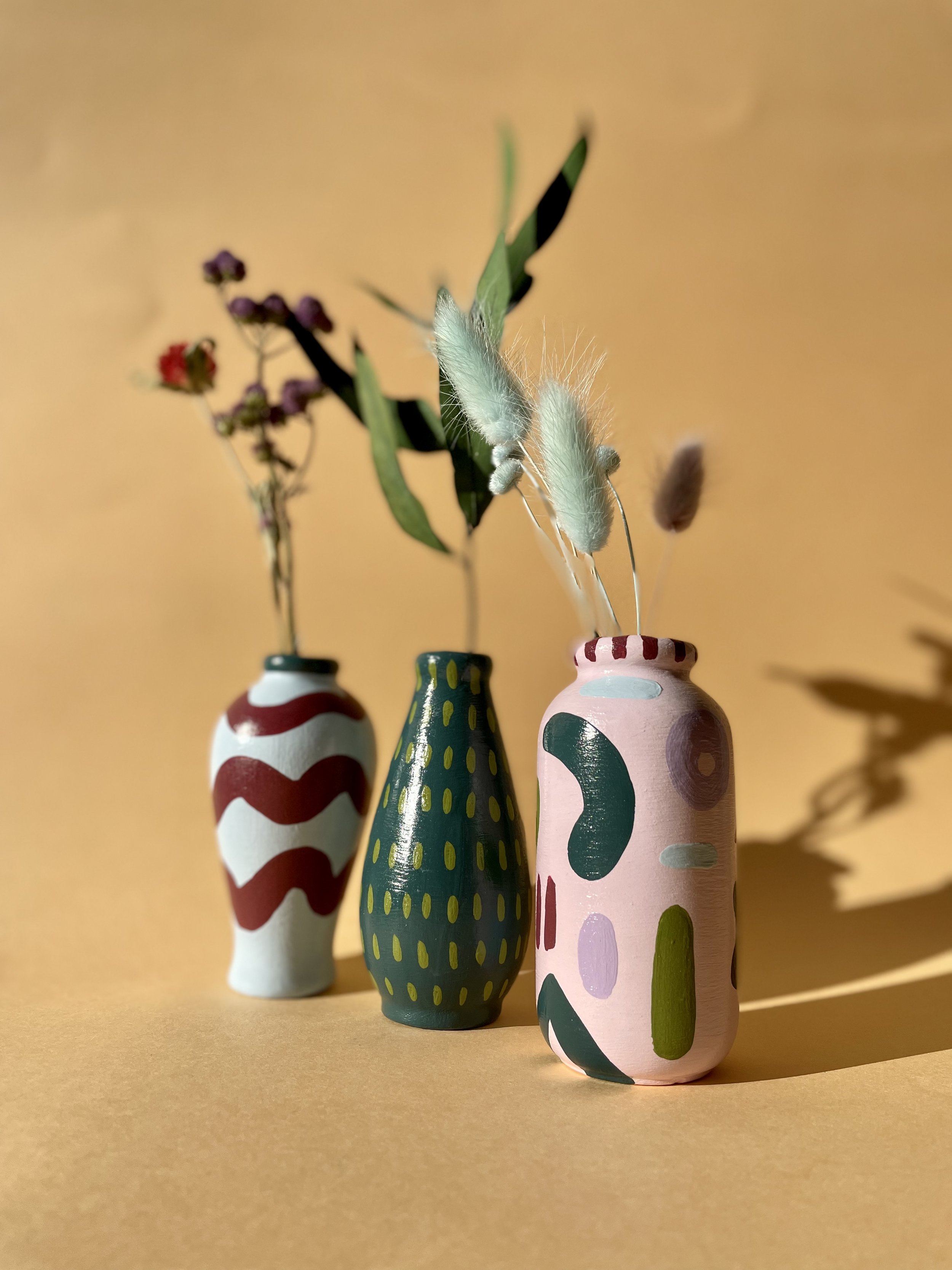 pink and green stem vases