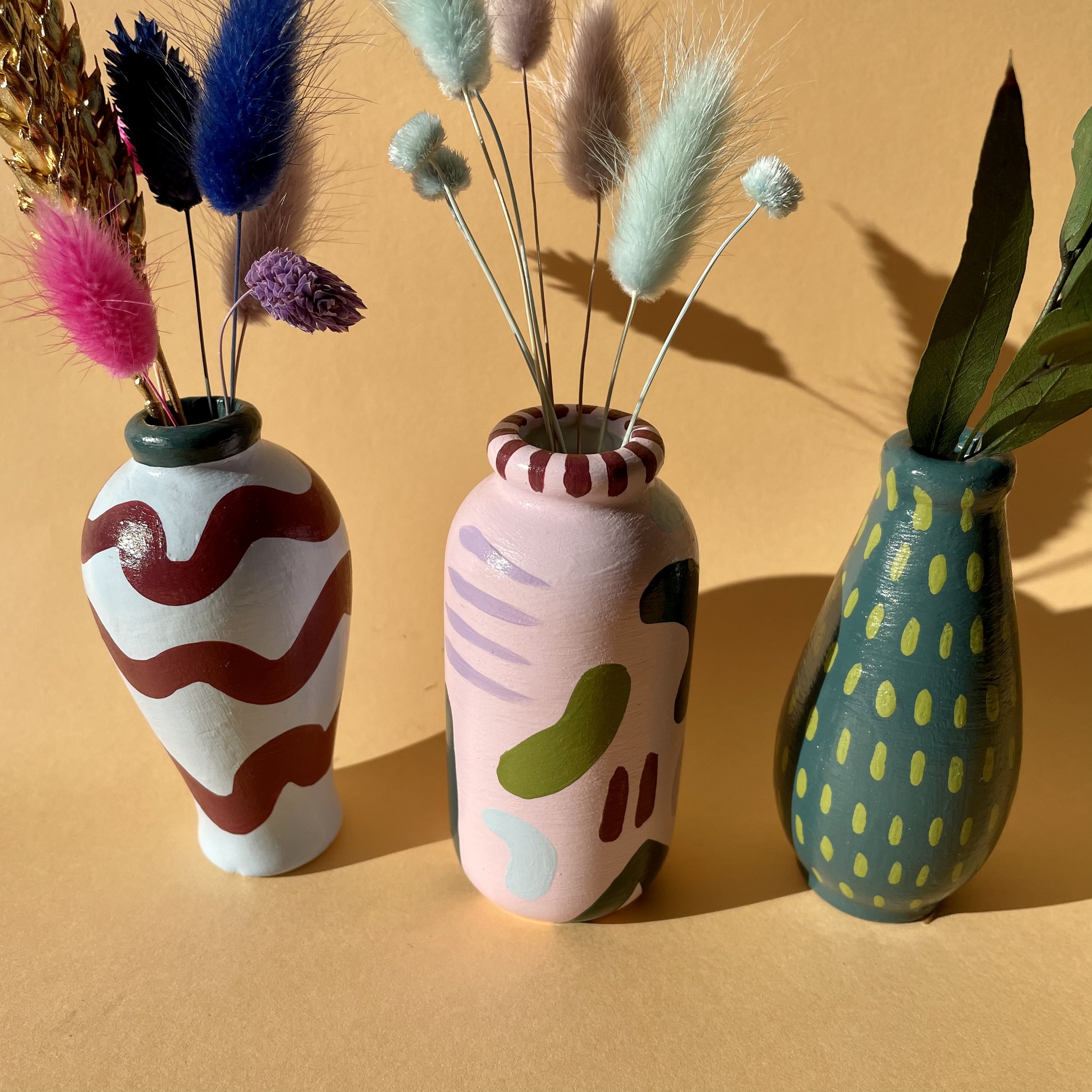 abstract stem vases with dried flowers