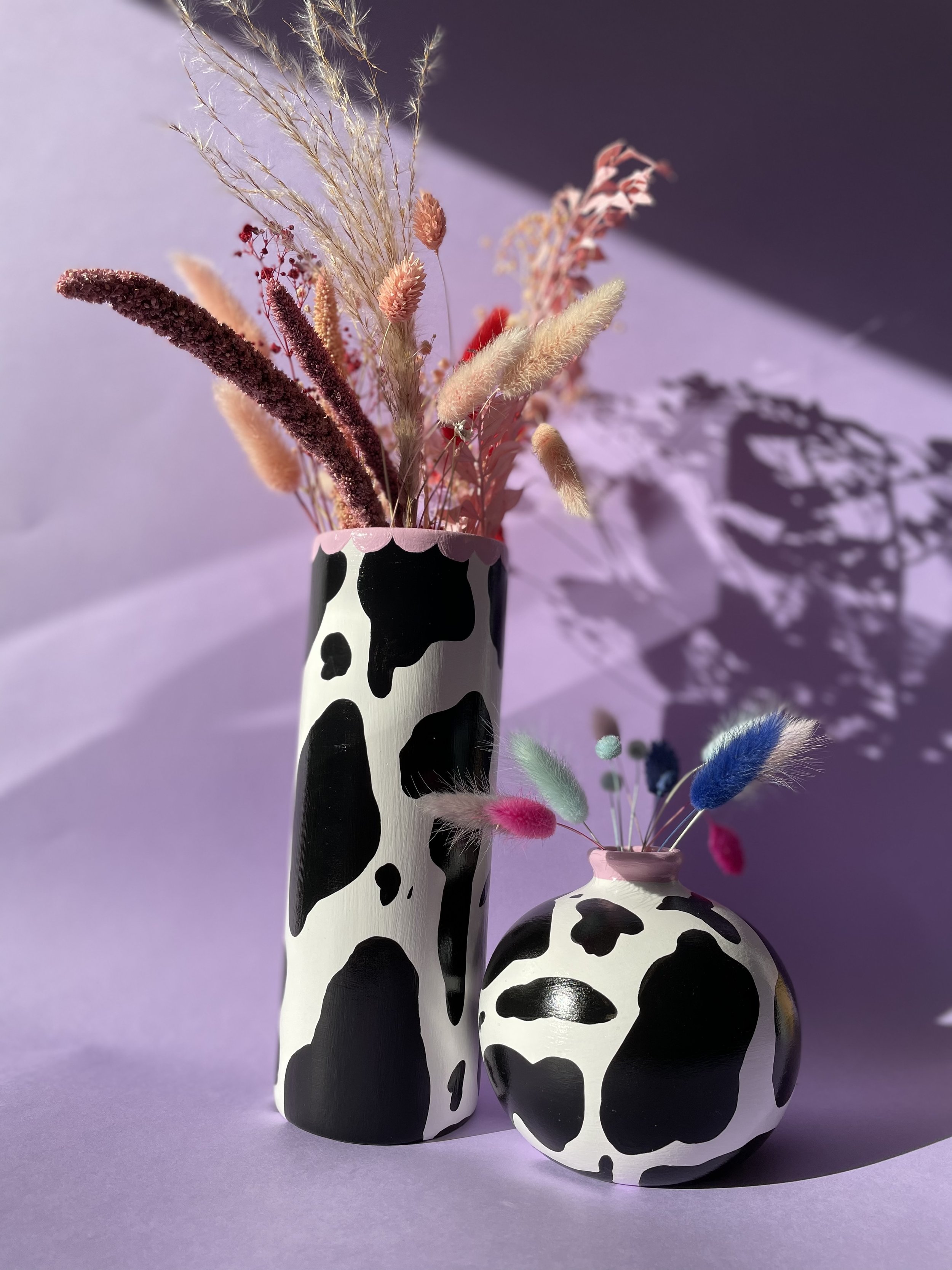 dried flowers in ceramic vases