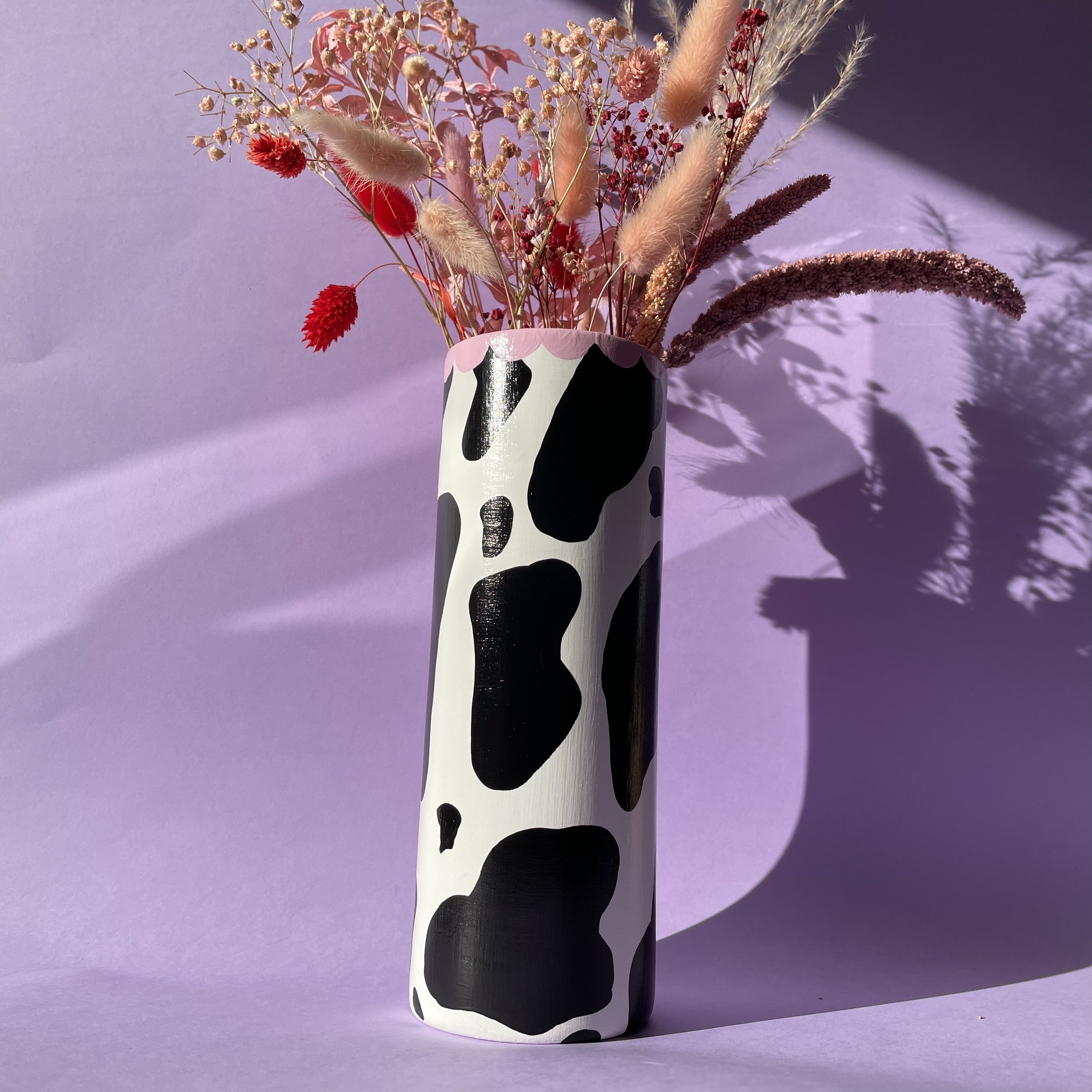 cow print vase with flowers