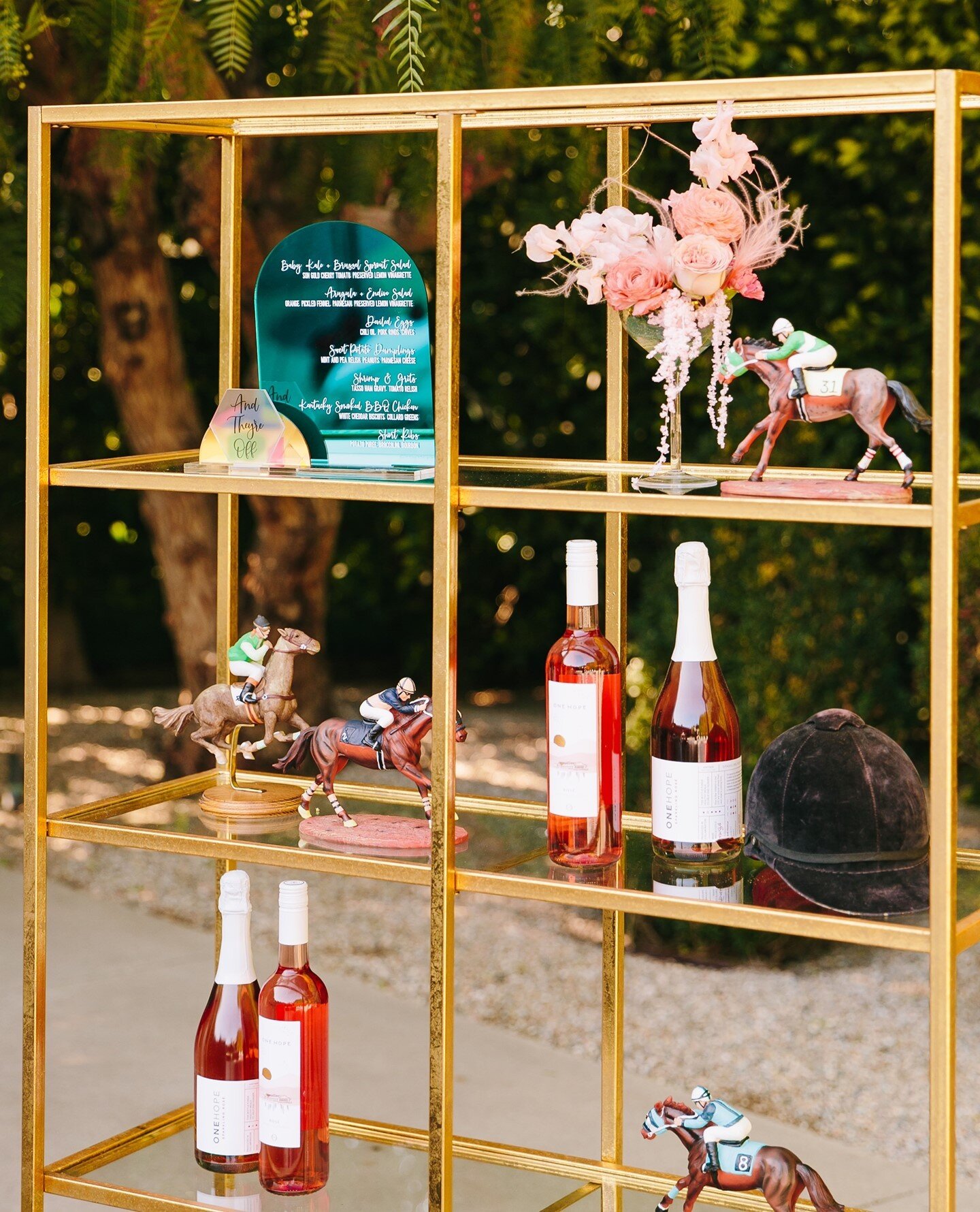 The most perfectly styled shelf by @figandwhiskey including Derby themed decor 🐎⁠
⁠
Featuring the Gold Essential Shelf that's commonly used as a backbar or to hold favors, name cards or decor.⁠
⁠
Venue @thefighouse⁠
Design @figandwhiskey⁠
Photograph