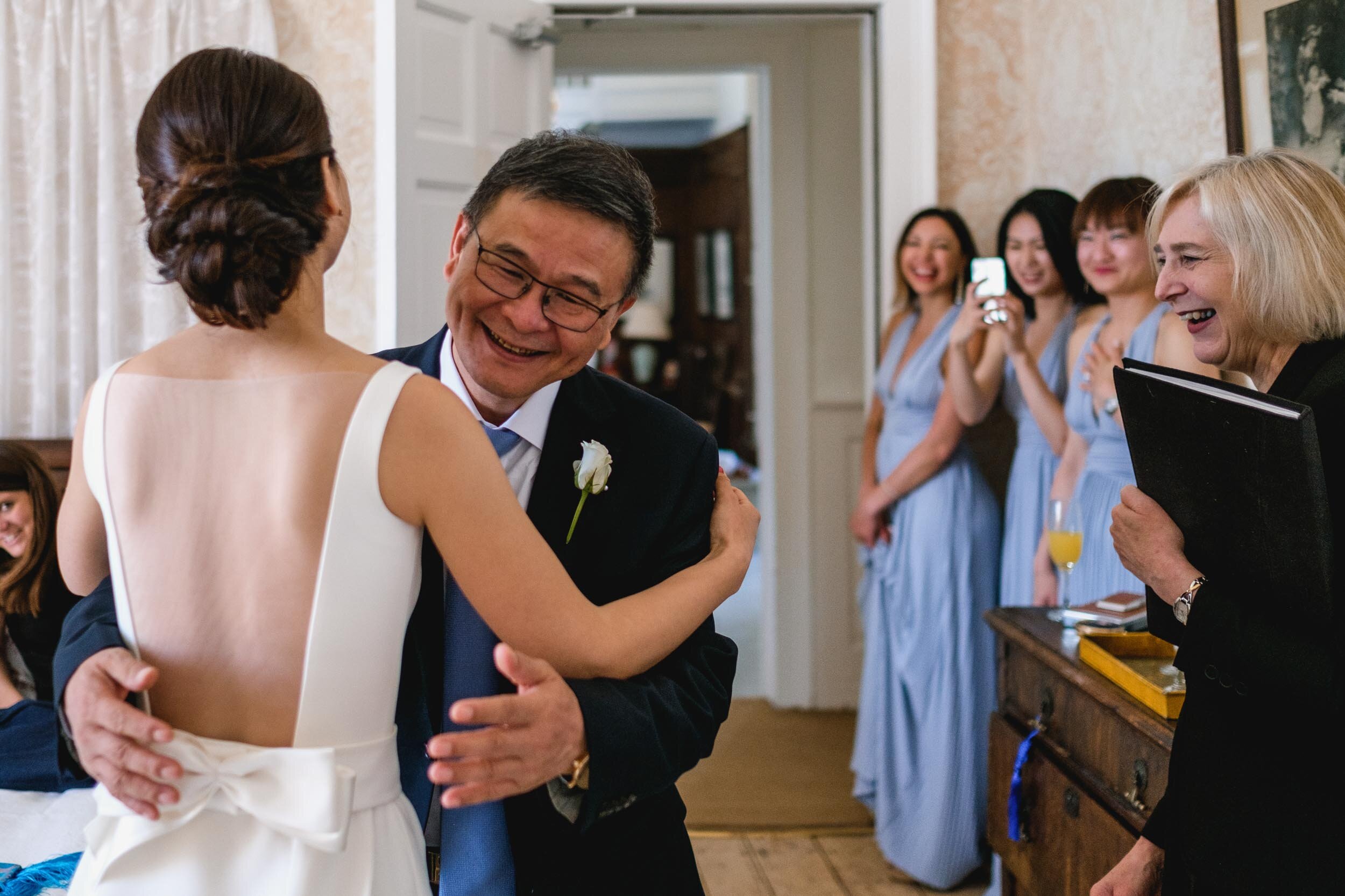 brides father greets her at butley priory