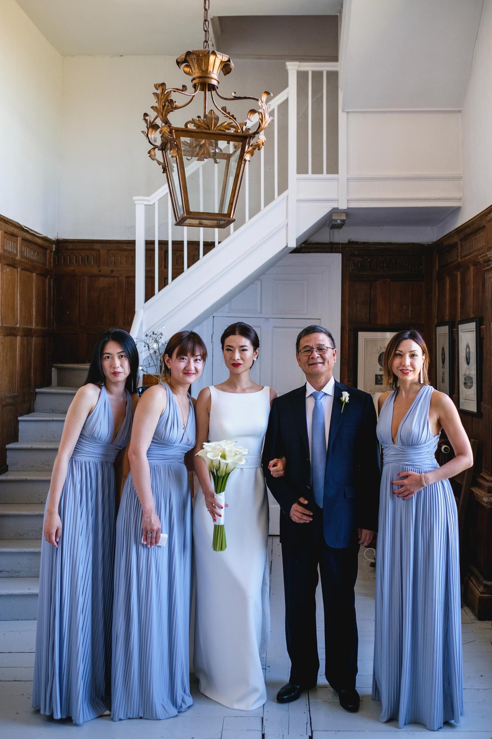 group photo of bridal party at butley priory