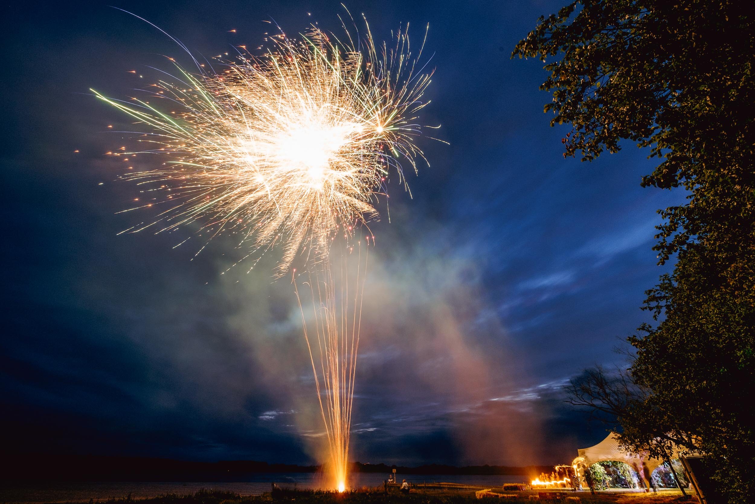 fireworks going off over the river alde at iken