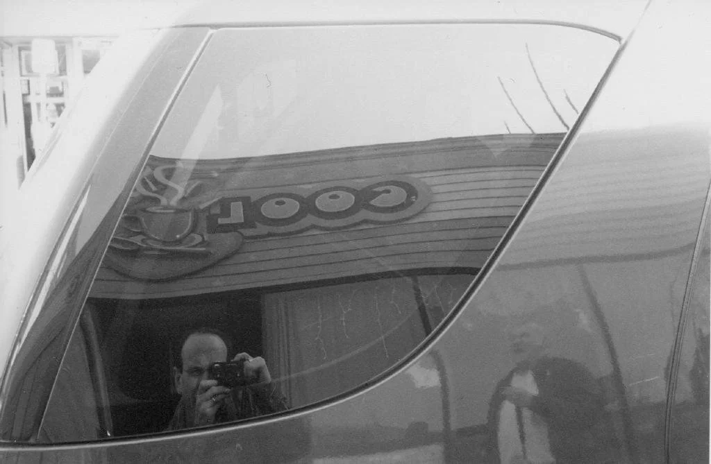 Rollei 35S reflects me and Woody off the car in front of Cool Beans, home of Poetry Oasis (Copy)