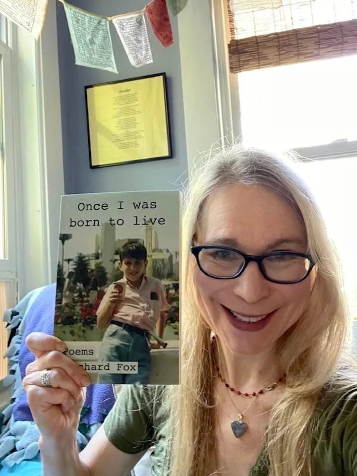 Nerissa Nields holding a copy of ONCE. Many of the book's poems were hatched in her "Writing It Up in the Garden"Wednesday afternoon group.