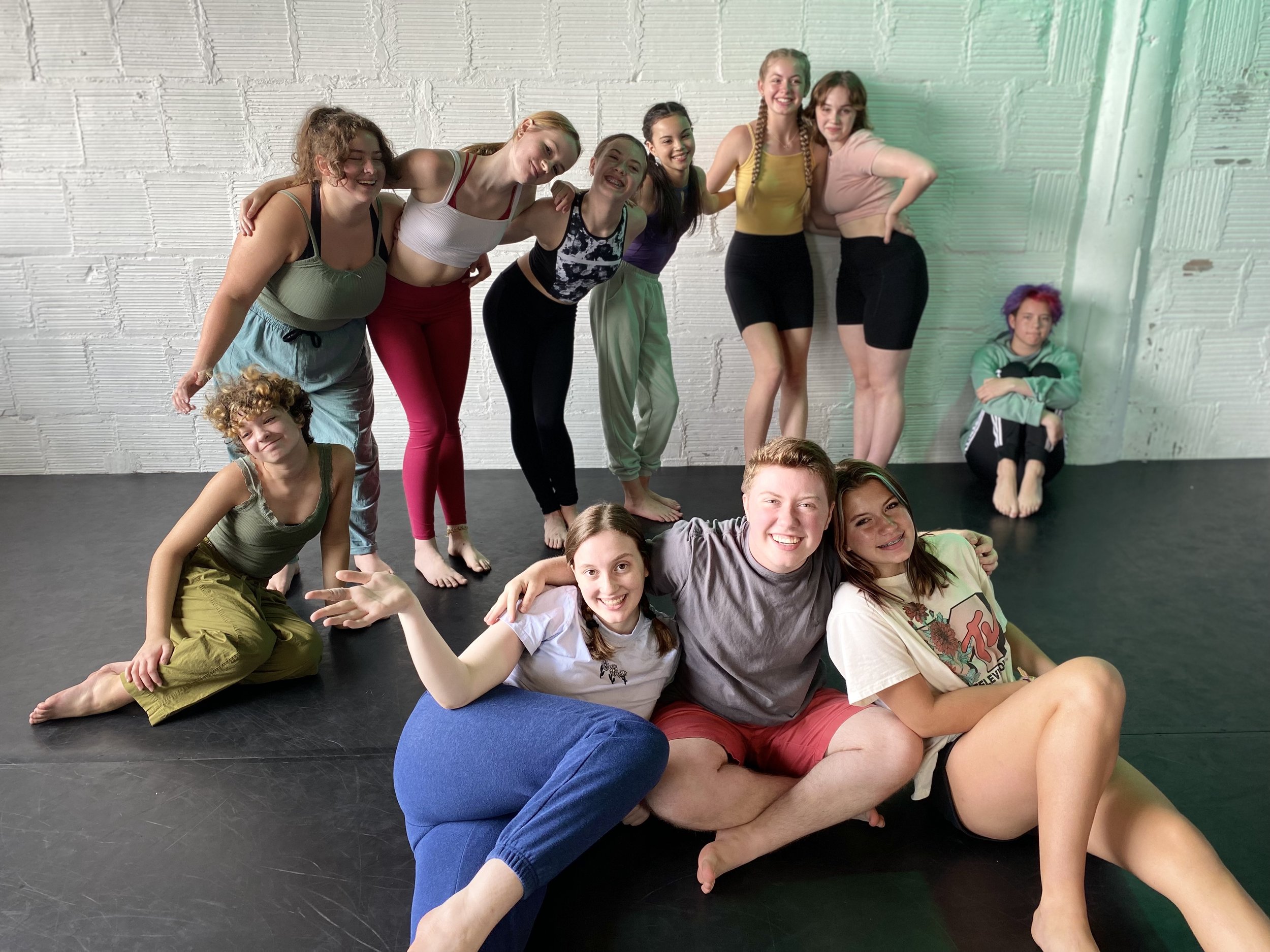 blue pants green pants pink shorts white shirt pose friends hug smiles fun  Dance dancer studio acting ballet jazz lyrical contemporary theater musical camp singing voice glee club Amber Keeley director Mpls classes twin cities workshops Spring Dance
