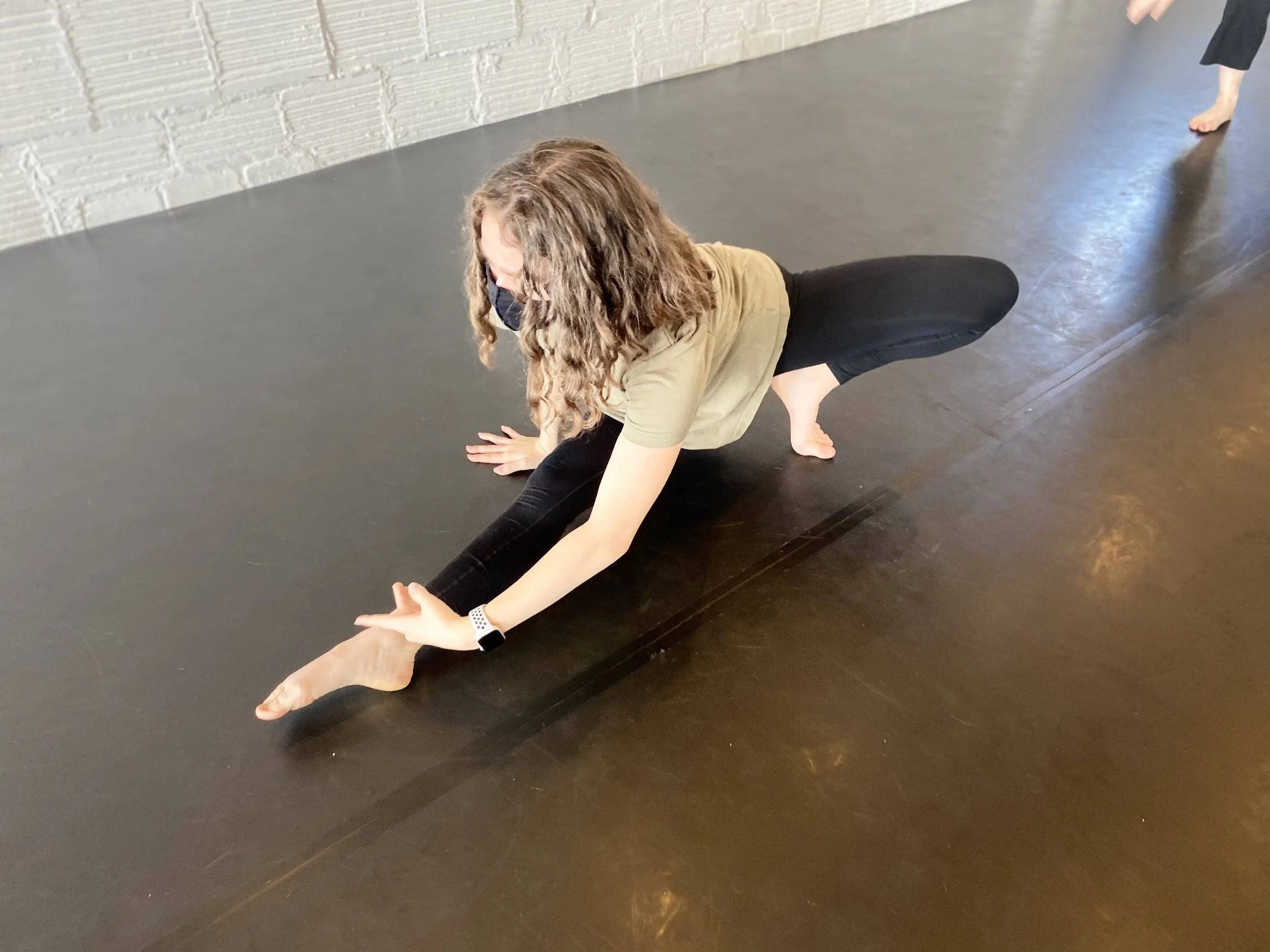 stretching black marly floor Dance acting ballet jazz lyrical contemporary theater musical camp singing voice glee club Amber Keeley director Mpls classes twin cities workshops Spring Dance Theatre Academy NE Minneapolis MN St St. Saint Paul Minnesot