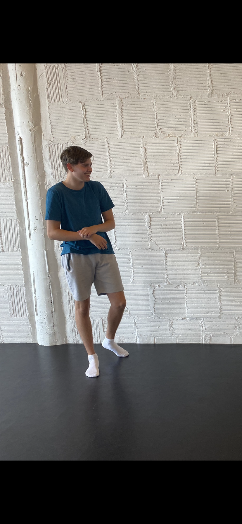 laughing boy blue short white brick wall Dance acting ballet jazz lyrical contemporary theater musical camp singing voice glee club Amber Keeley director Mpls classes twin cities workshops Spring Dance Theatre Academy NE Minneapolis MN St St. Saint P