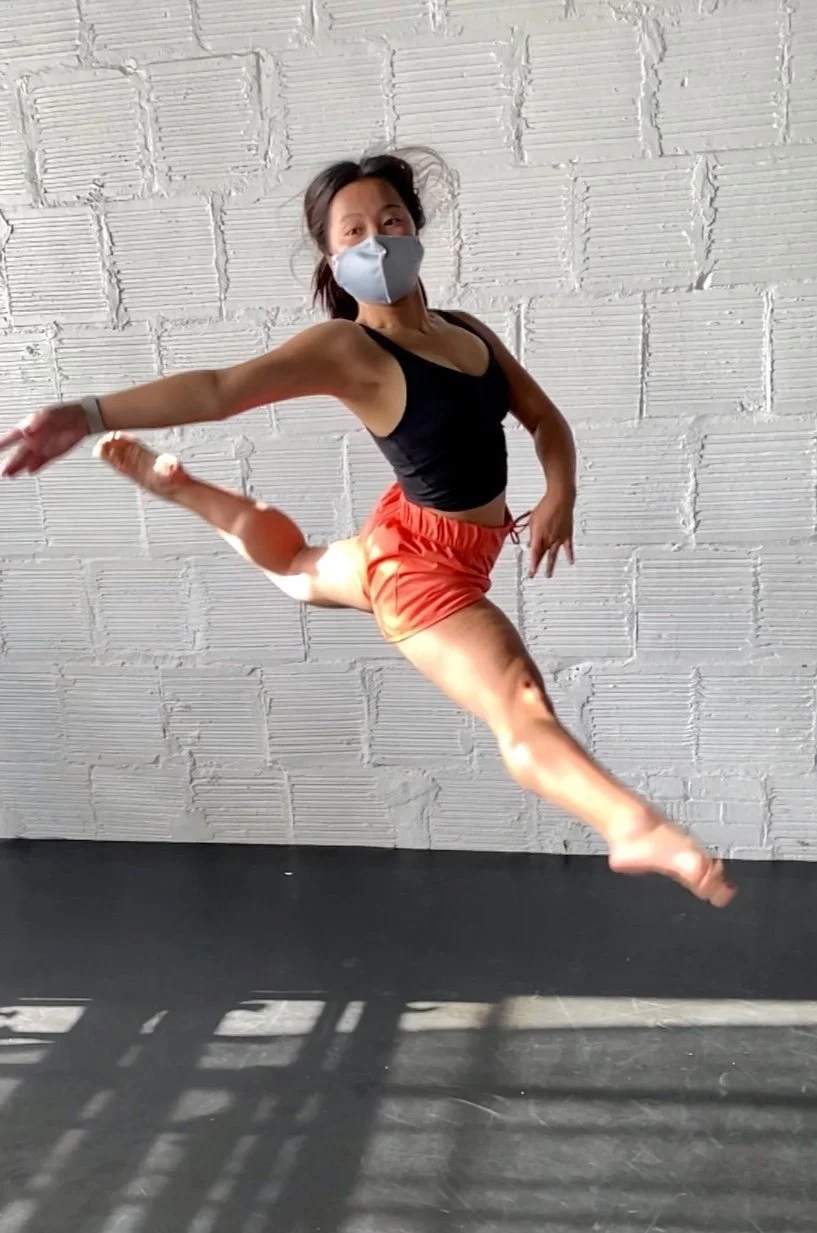 leap orange shorts white brick wall Dance dancer acting ballet jazz lyrical contemporary theater musical camp singing voice glee club Amber Keeley director Mpls classes twin cities workshops Spring Dance Theatre Academy NE Minneapolis MN St St. Saint