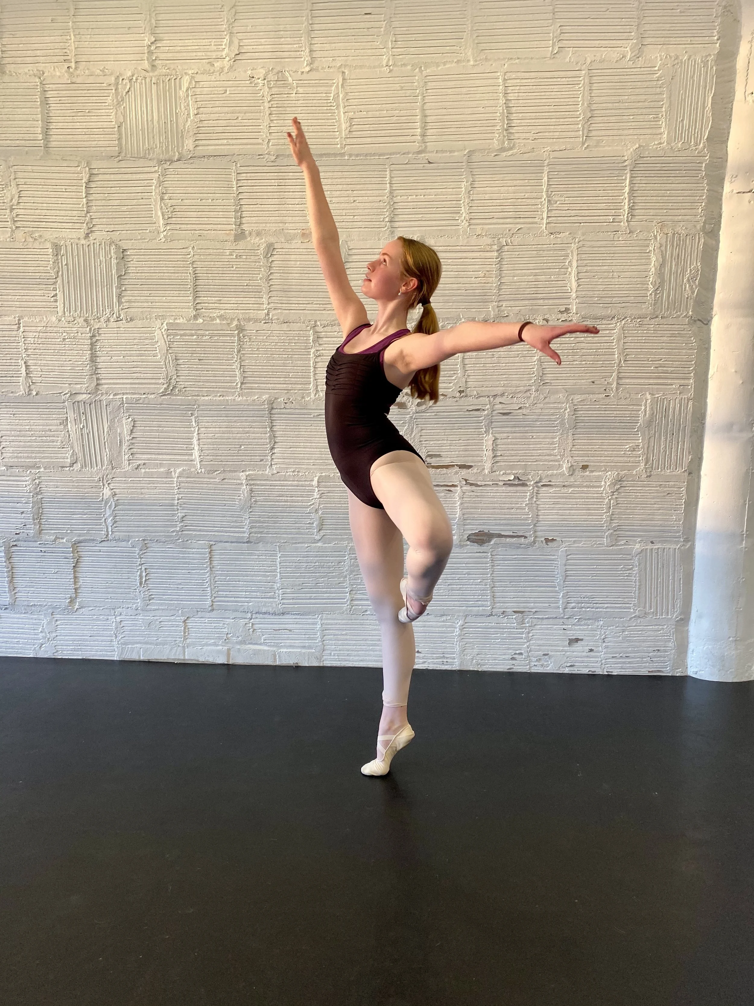 passé white brick wall black leotard Dance dancer studio acting ballet jazz lyrical contemporary theater musical camp singing voice glee club Amber Keeley director Mpls classes twin cities workshops Spring Dance Theatre Academy NE Minneapolis MN St S
