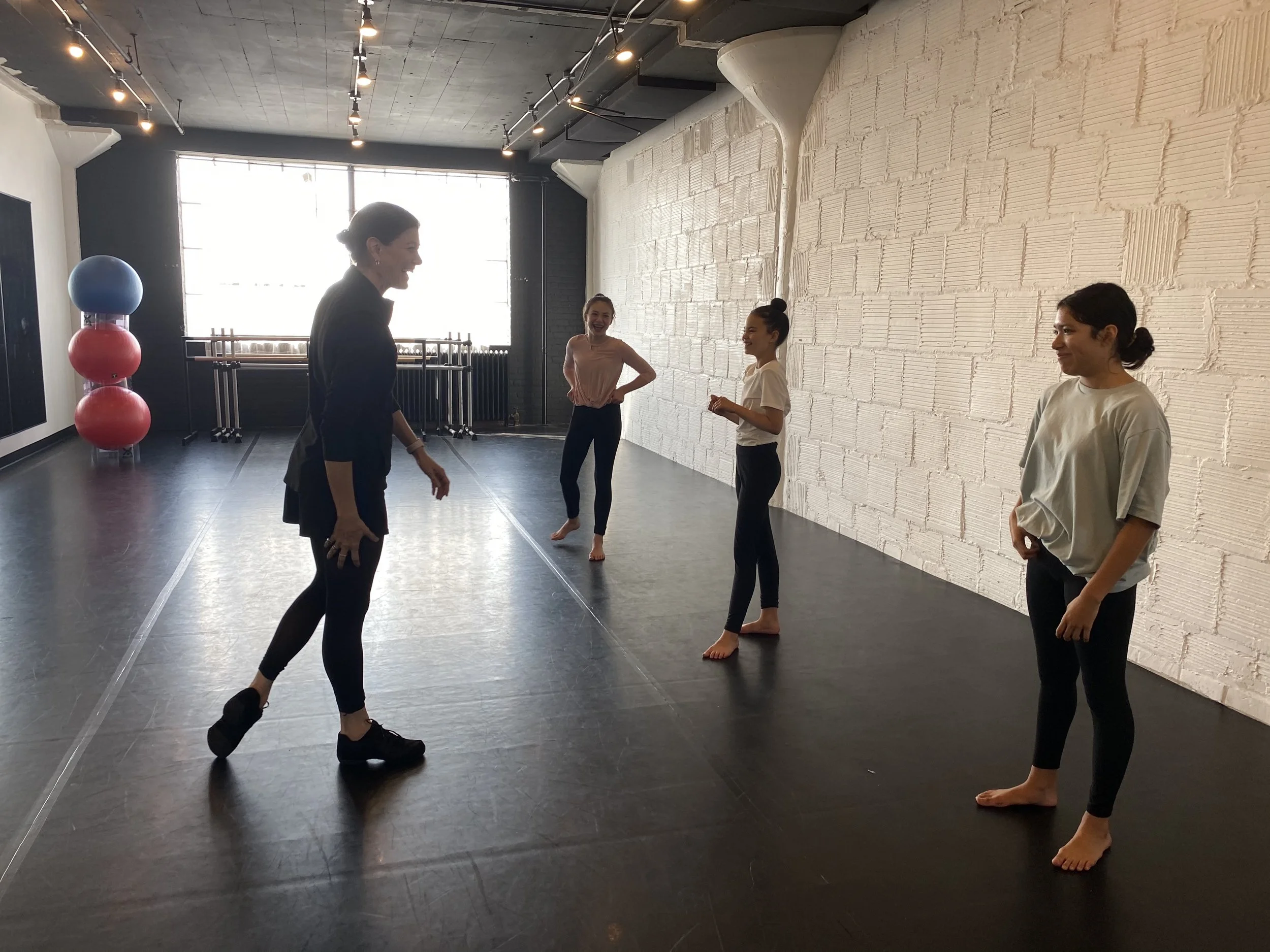 class teaching 3 girls yoga balls Dance acting ballet jazz lyrical contemporary theater musical camp singing voice glee club Amber Keeley director Mpls classes twin cities workshops Spring Dance Theatre Academy NE Minneapolis MN St St. Saint Paul Min