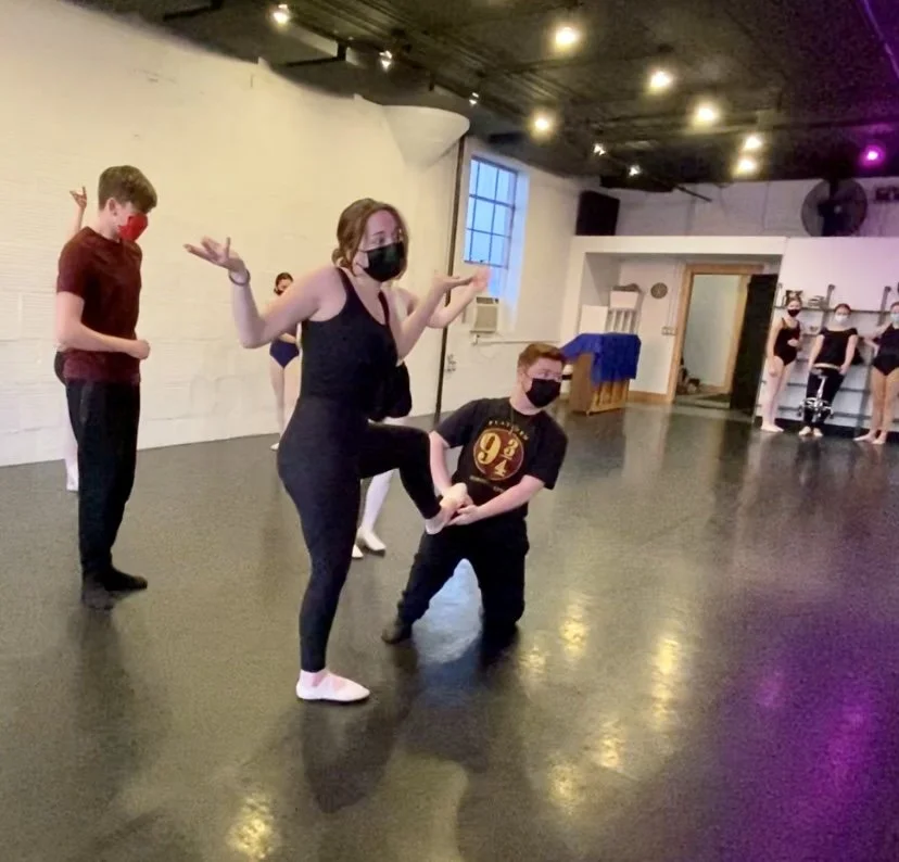 shoe fitting shrug purple light one knee Dance dancer studio acting ballet jazz lyrical contemporary theater musical camp singing voice glee club Amber Keeley director Mpls classes twin cities workshops Spring Dance Theatre Academy NE Minneapolis MN 