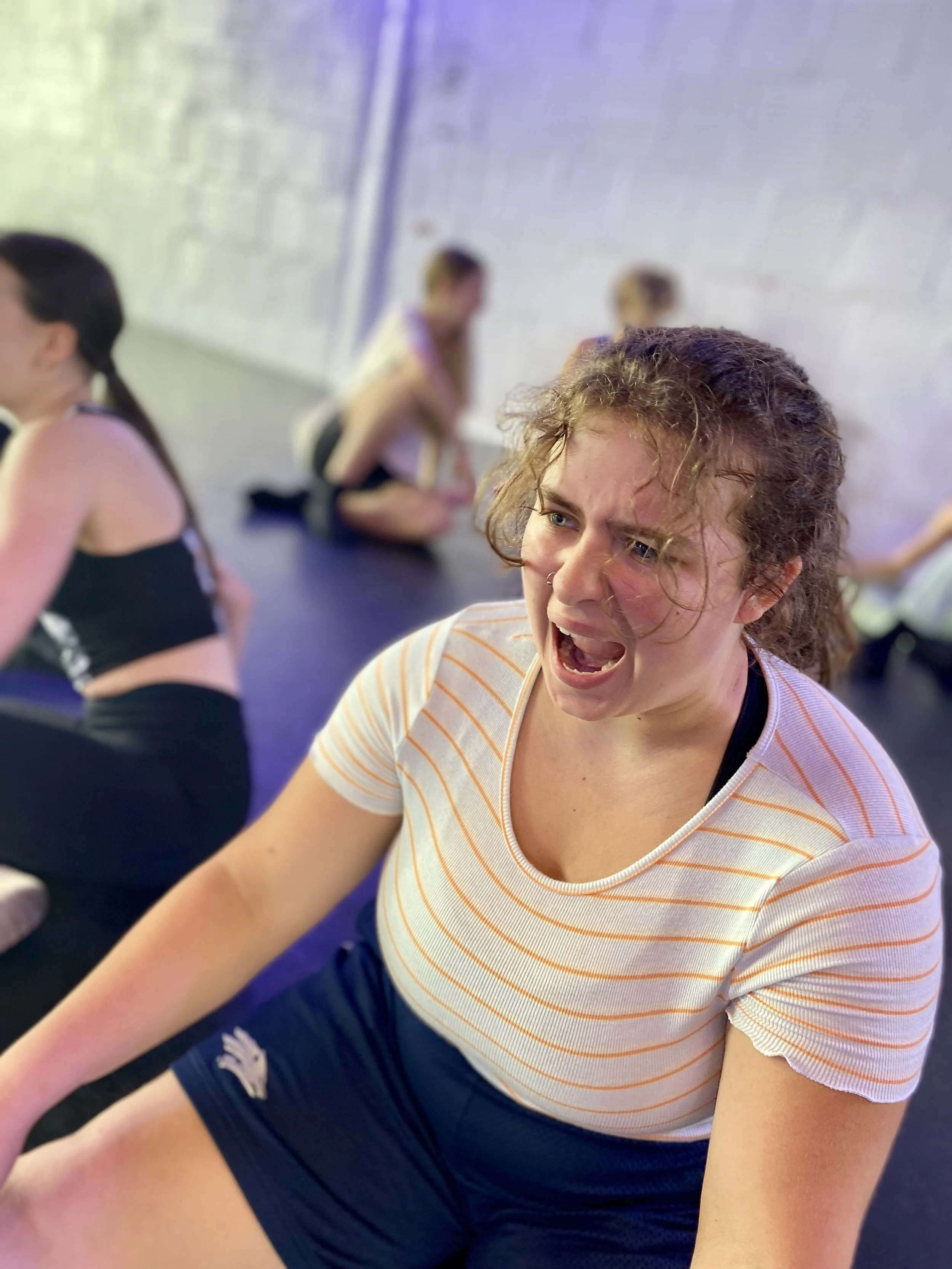 yellow striped shirt blue shorts white brick wall black floor angry child Dance dancer studio acting ballet jazz lyrical contemporary theater musical camp singing voice glee club Amber Keeley director Mpls classes twin cities workshops Spring Dance T