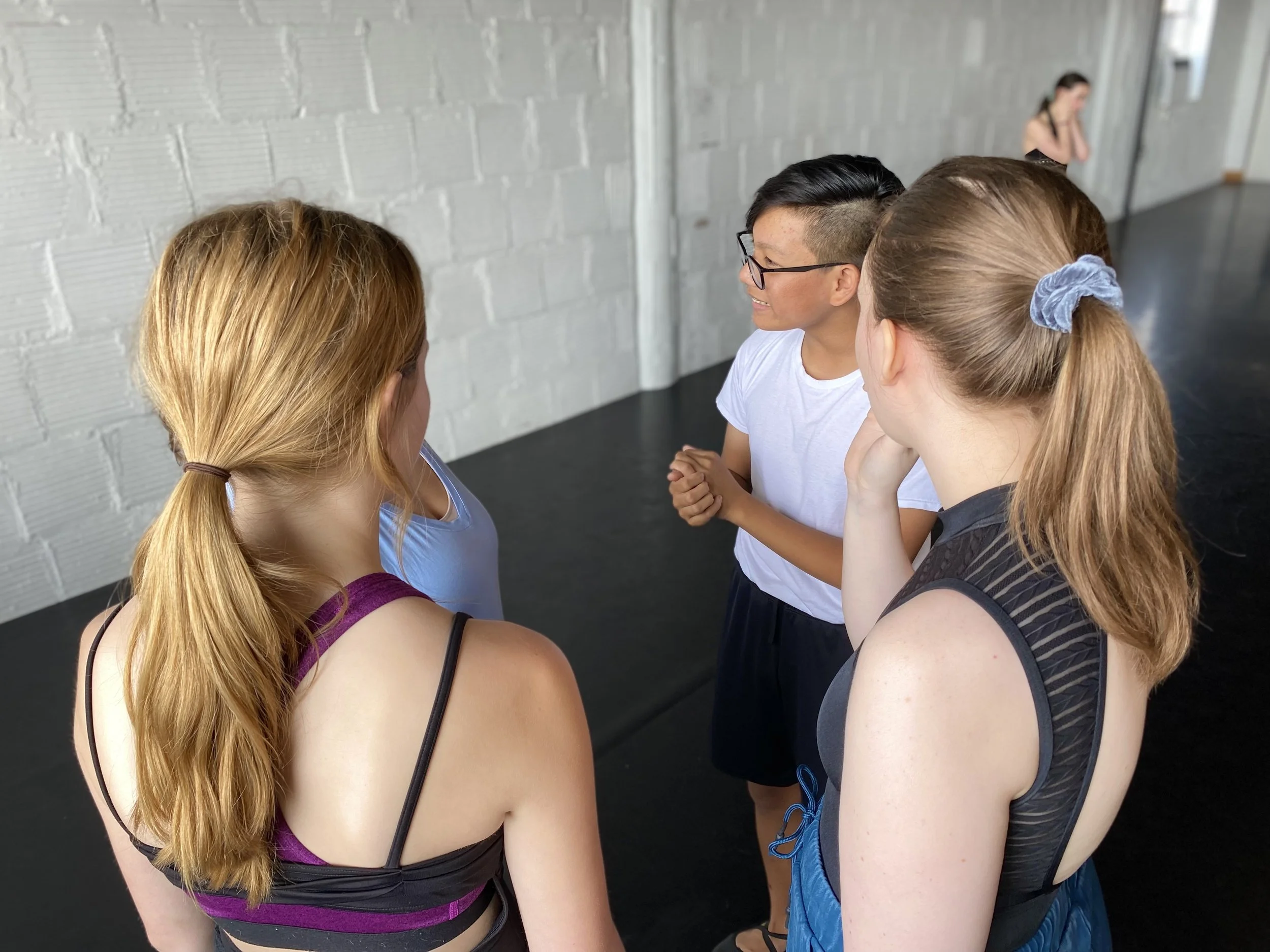 black leotard blue skirt white brick wall white shirt black shorts gray scrunchies Dance dancer studio acting ballet jazz lyrical contemporary theater musical camp singing voice glee club Amber Keeley director Mpls classes twin cities workshops Sprin