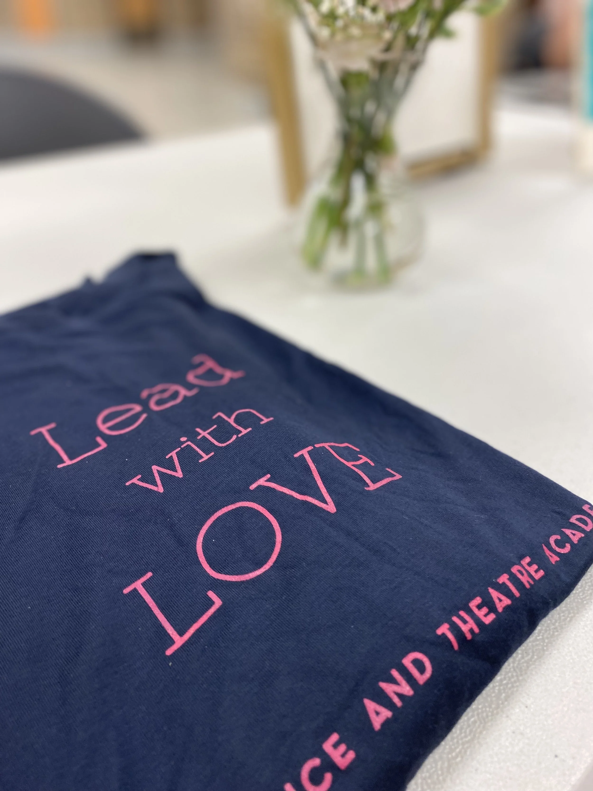 lead with love flowers navy bright pink Sherri Stewart Dance dancer studio acting ballet jazz lyrical contemporary theater musical camp singing voice glee club Amber Keeley director Mpls classes twin cities workshops Spring Dance Theatre Academy NE M