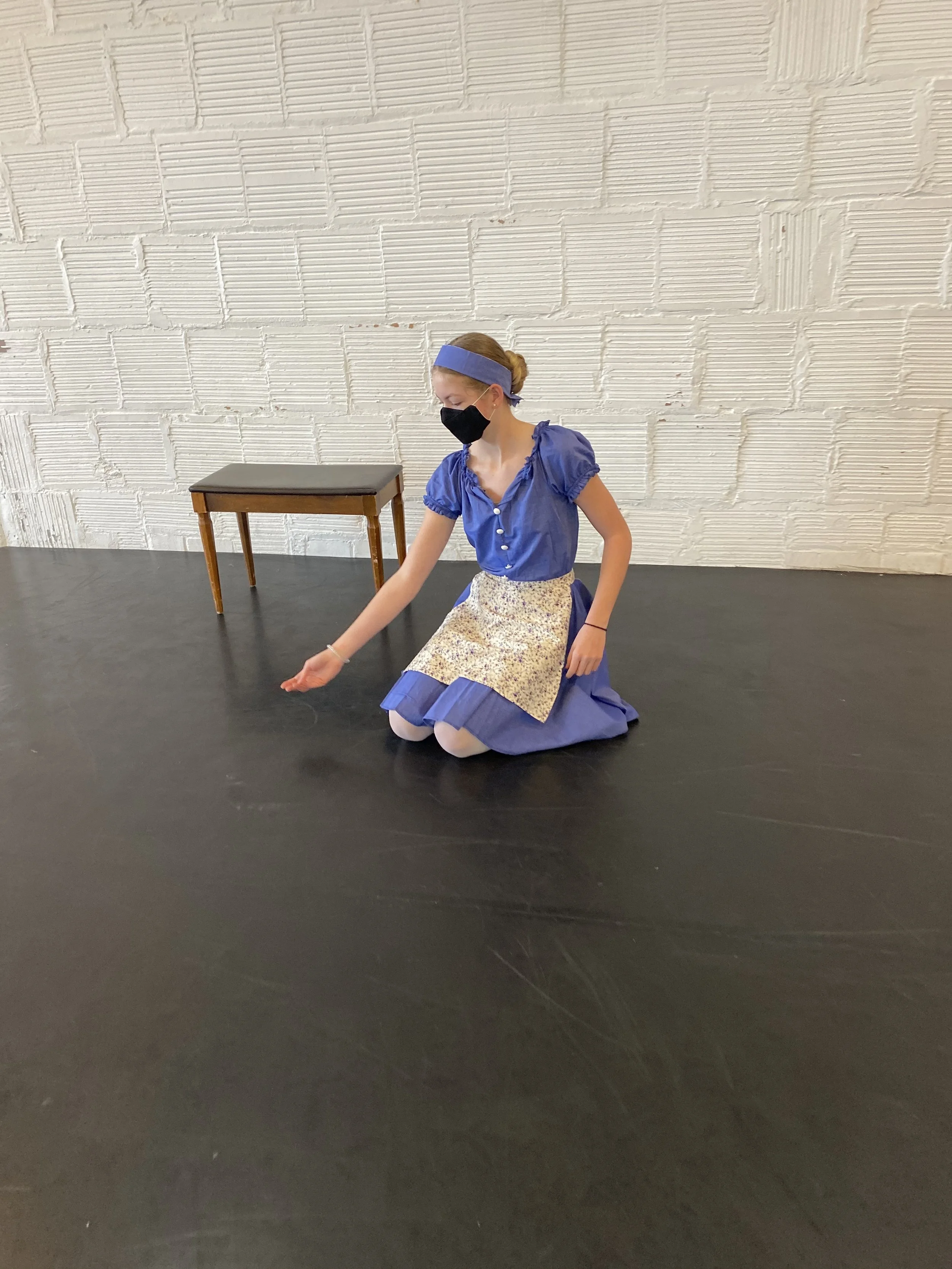 cinderella on knees bench white brick wall  Dance dancer studio acting ballet jazz lyrical contemporary theater musical camp singing voice glee club Amber Keeley director Mpls classes twin cities workshops Spring Dance Theatre Academy NE Minneapolis 