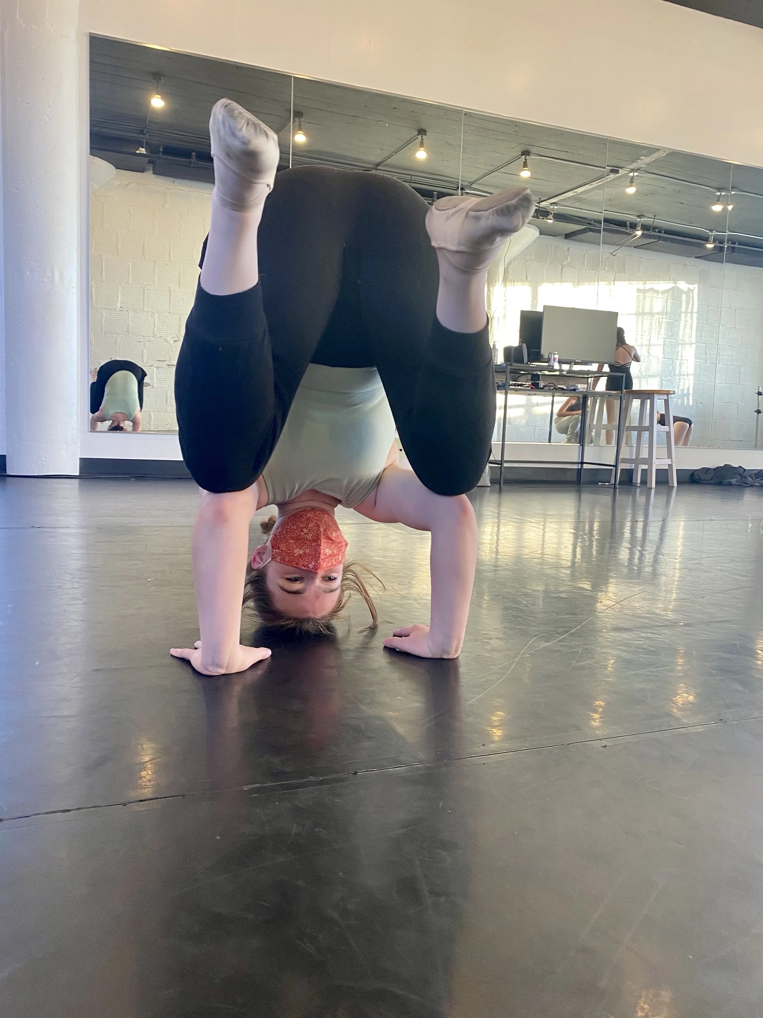 headstand orange mask black pants green leotard mirror Dance dancer studio acting ballet jazz lyrical contemporary theater musical camp singing voice glee club Amber Keeley director Mpls classes twin cities workshops Spring Dance Theatre Academy NE M