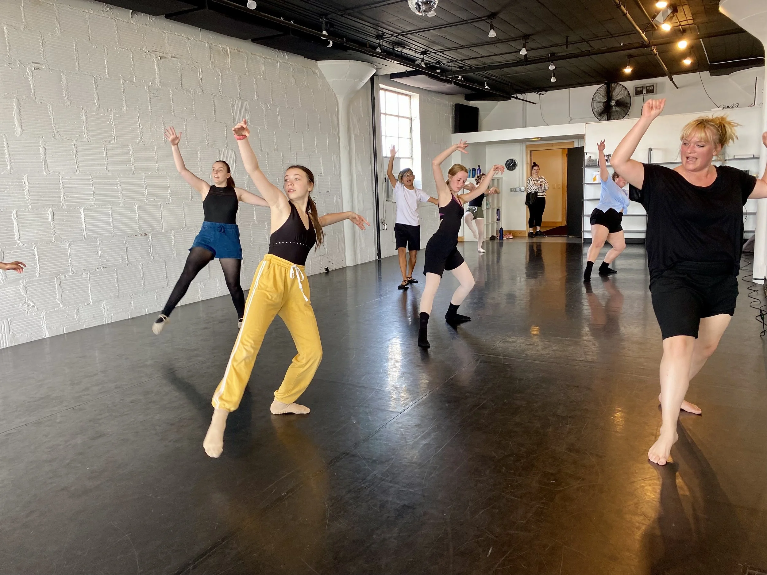 yellow pants blue skirt black tights black Leo black shirt pink tights white shirt white brick wall black floor lights Dance dancer studio acting ballet jazz lyrical contemporary theater musical camp singing voice glee club Amber Keeley director Mpls