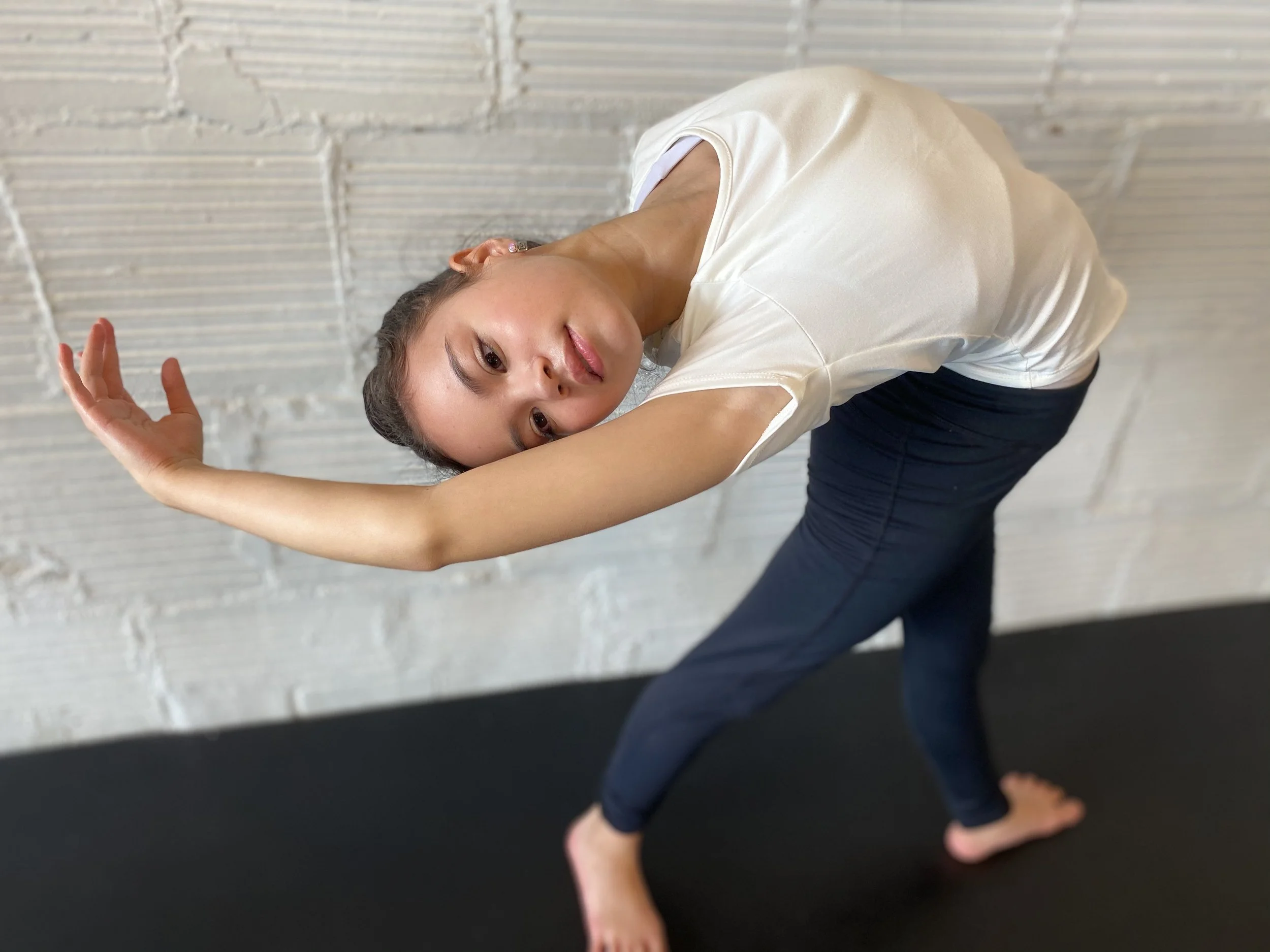 arched back white shirt white brick wall Dance acting ballet jazz lyrical contemporary theater musical camp singing voice glee club Amber Keeley director Mpls classes twin cities workshops Spring Dance Theatre Academy NE Minneapolis MN St St. Saint P