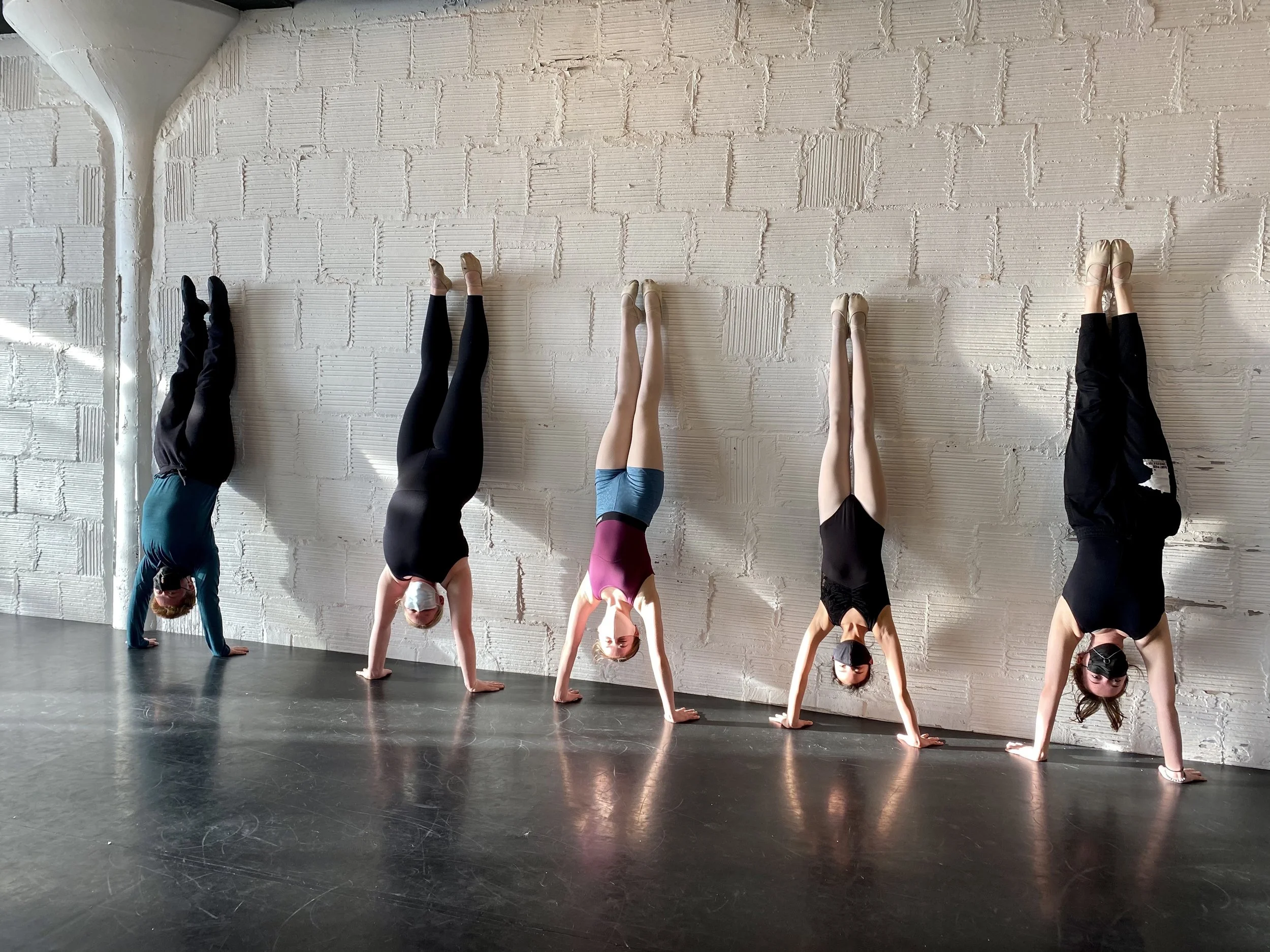 handstand 5 kids white brick wall Dance dancer studio acting ballet jazz lyrical contemporary theater musical camp singing voice glee club Amber Keeley director Mpls classes twin cities workshops Spring Dance Theatre Academy NE Minneapolis MN St St. 