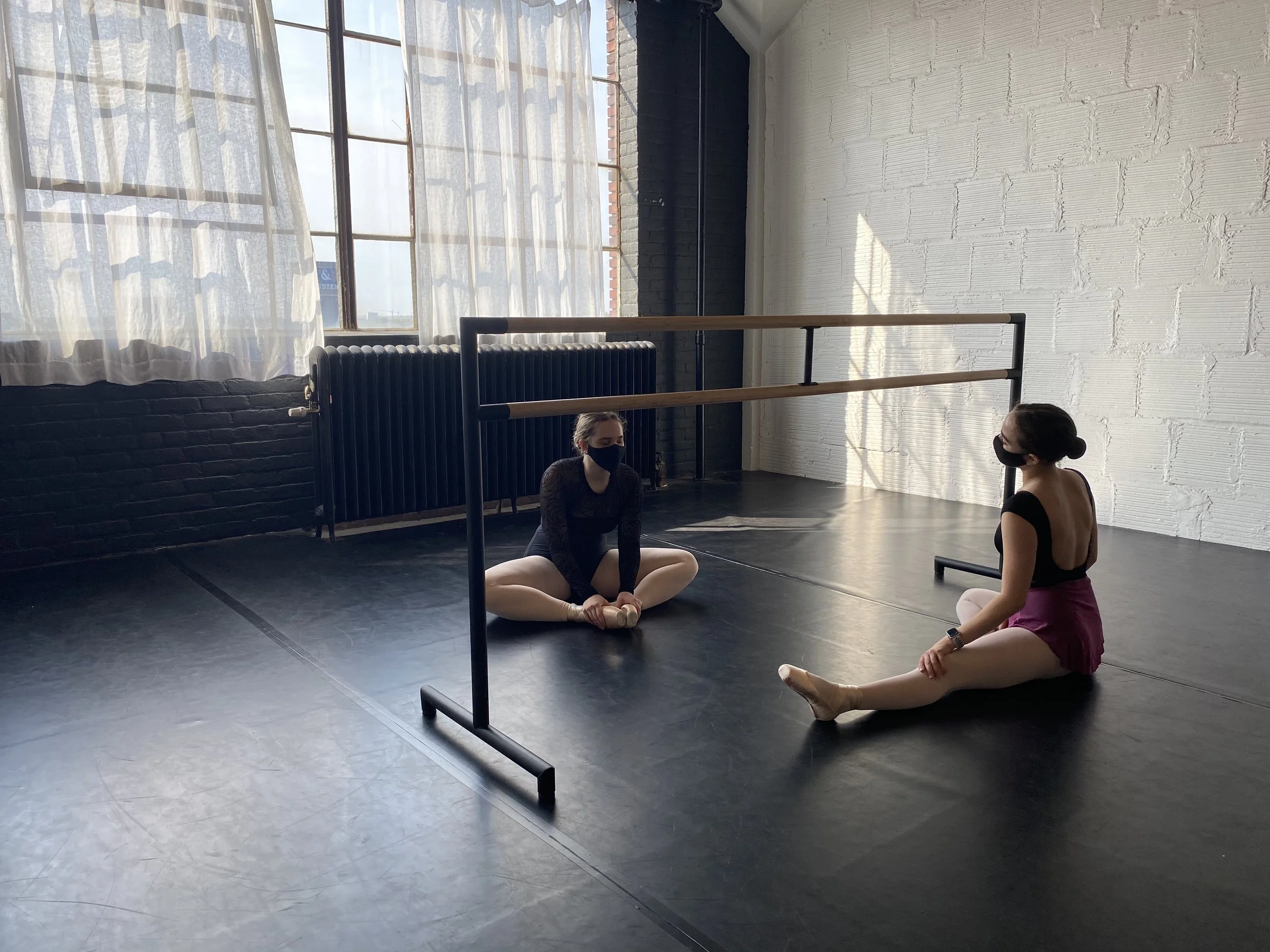 barre stretching window black floor white wall Dance acting ballet jazz lyrical contemporary theater musical camp singing voice glee club Amber Keeley director Mpls classes twin cities workshops Spring Dance Theatre Academy NE Minneapolis MN St St. S