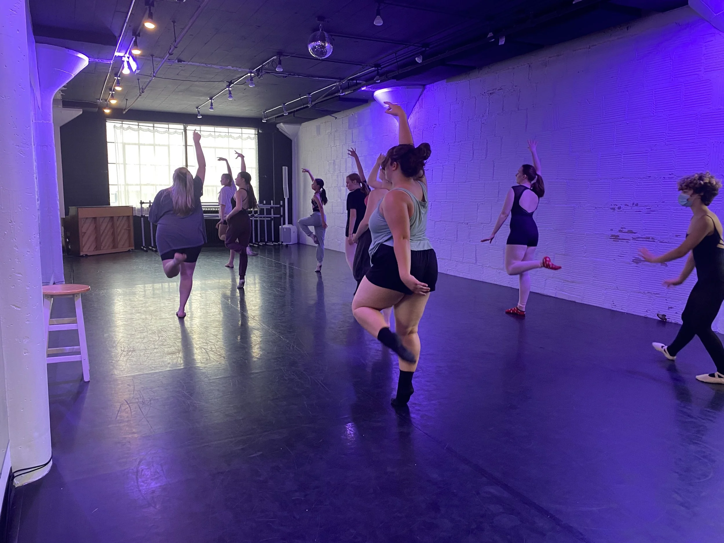 class learning teaching teacher Rachel Doran pose purple lights mood window shadow stool piano  Dance dancer studio acting ballet jazz lyrical contemporary theater musical camp singing voice glee club Amber Keeley director Mpls classes twin cities wo