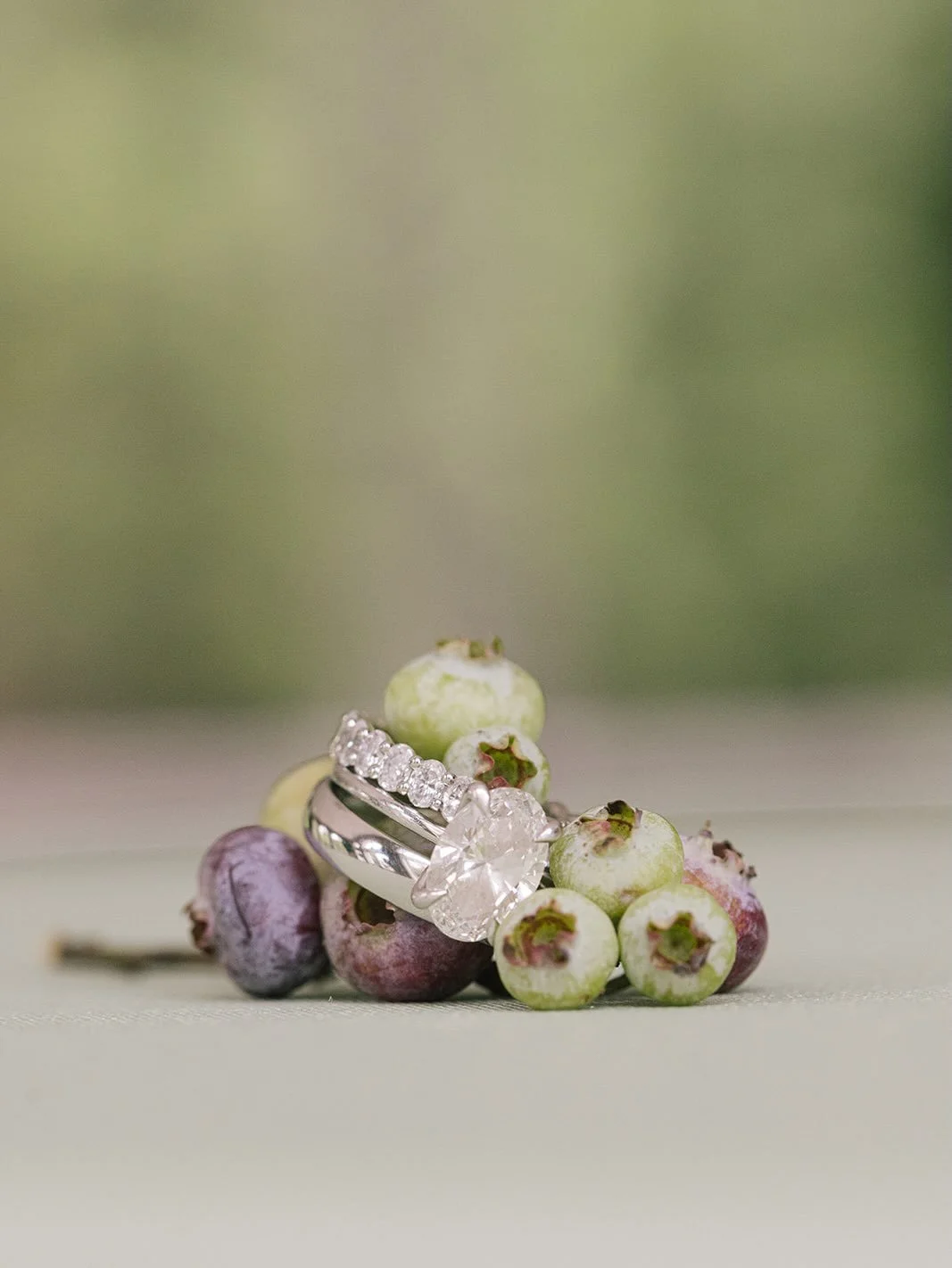 Our favorite details | jewelry, fruit + florals 💍🌿🫐

Venue | @laurelhallindy 
Caterer | @jacquies_gourmet_catering 
Photographer | @lorealmade 
Band | @bluewaterkingsband 
Florist | @mollyandmyrtle 
Draping | @indydreamevents 
Bride | @maddiechrza