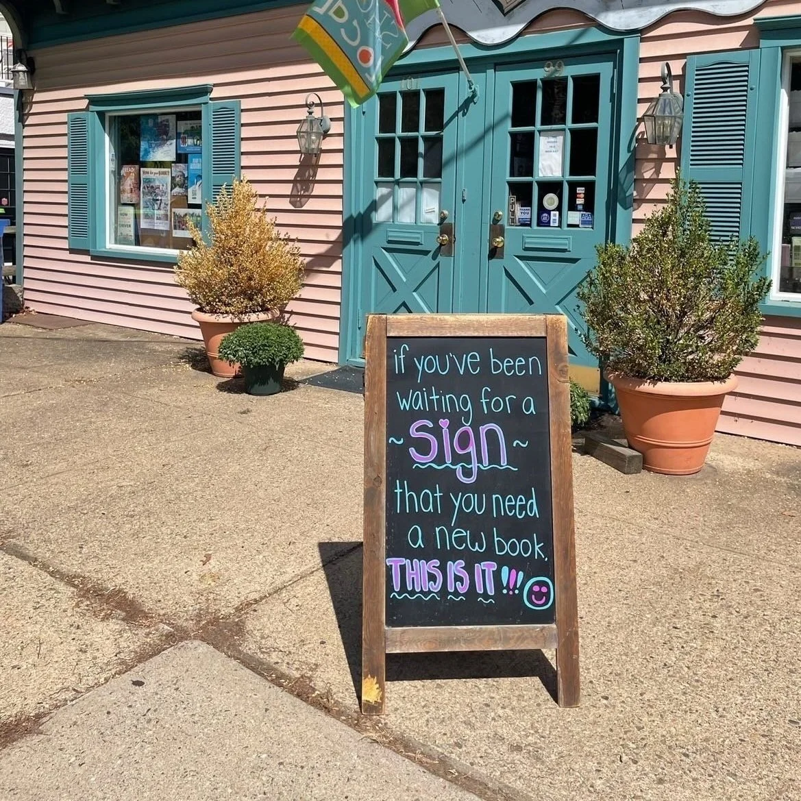 The Bookworm absolutely nailed it with these sidewalk signs — Visit