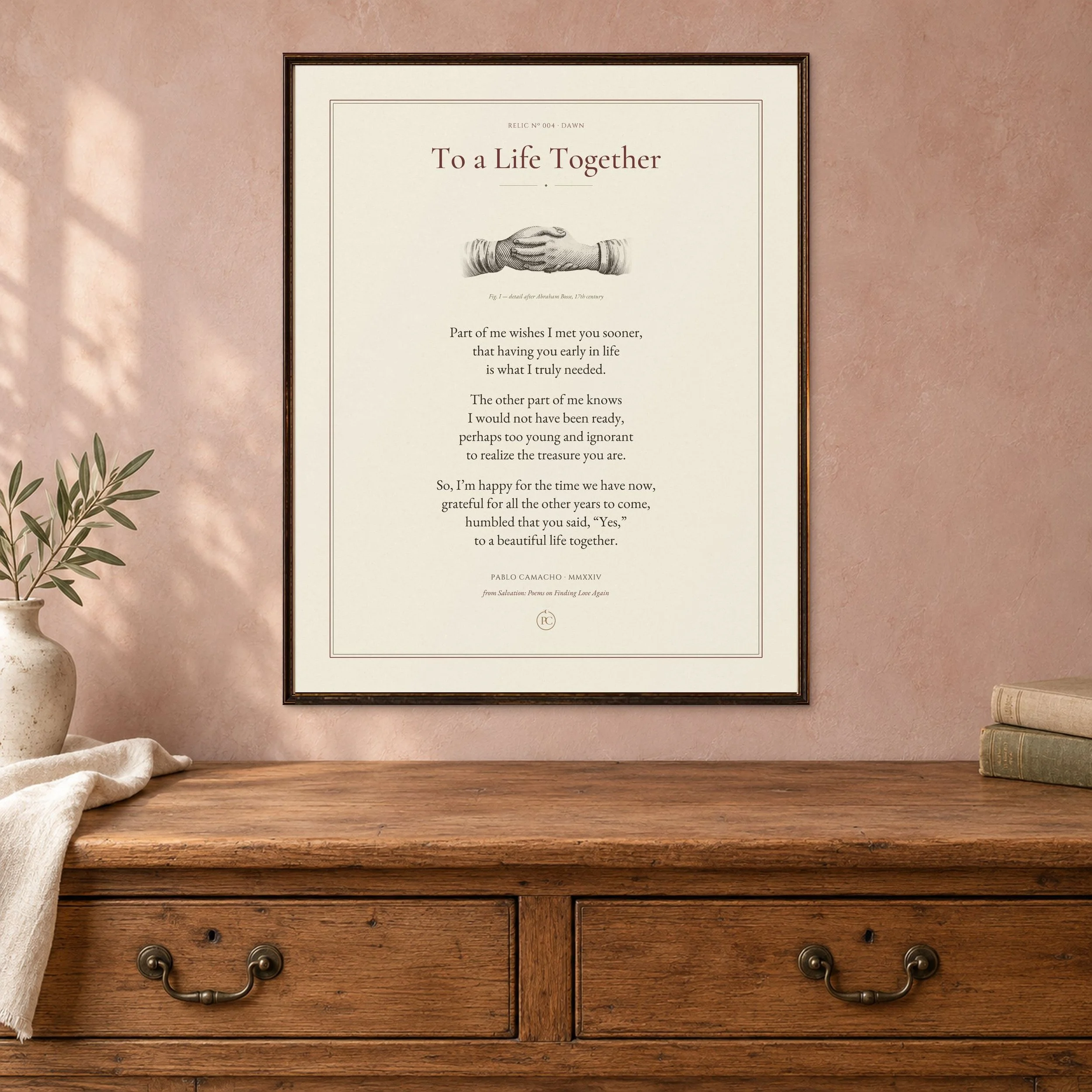 To a Life Together poetry print with a clasped-hands illustration, framed above a wooden dresser in morning light