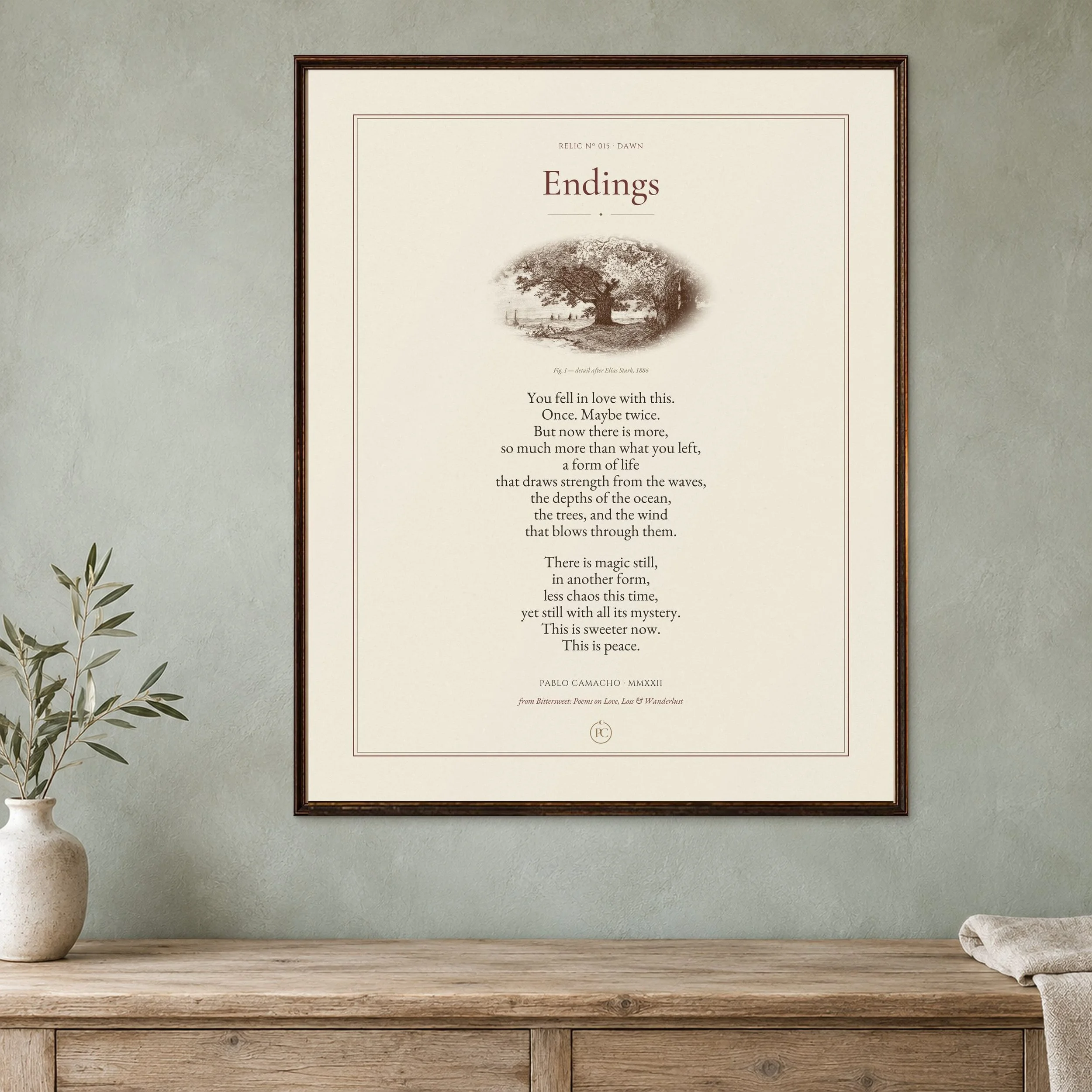 Endings poetry print with an etching of trees above a beach and the sea, framed on a sage wall beside an olive branch