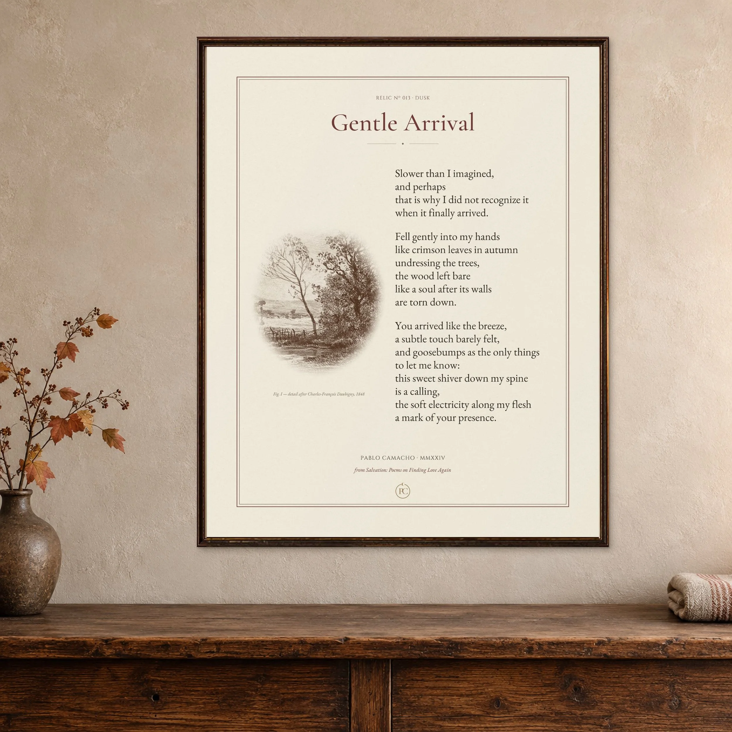 Gentle Arrival poetry print with an autumn landscape etching, framed on a warm wall beside a vase of autumn leaves