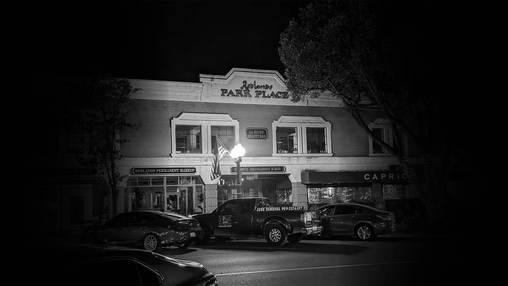 Hall Of Shadows Mystery Games is located inside the "Redlands Park Place" building below the Caprice Cafe.