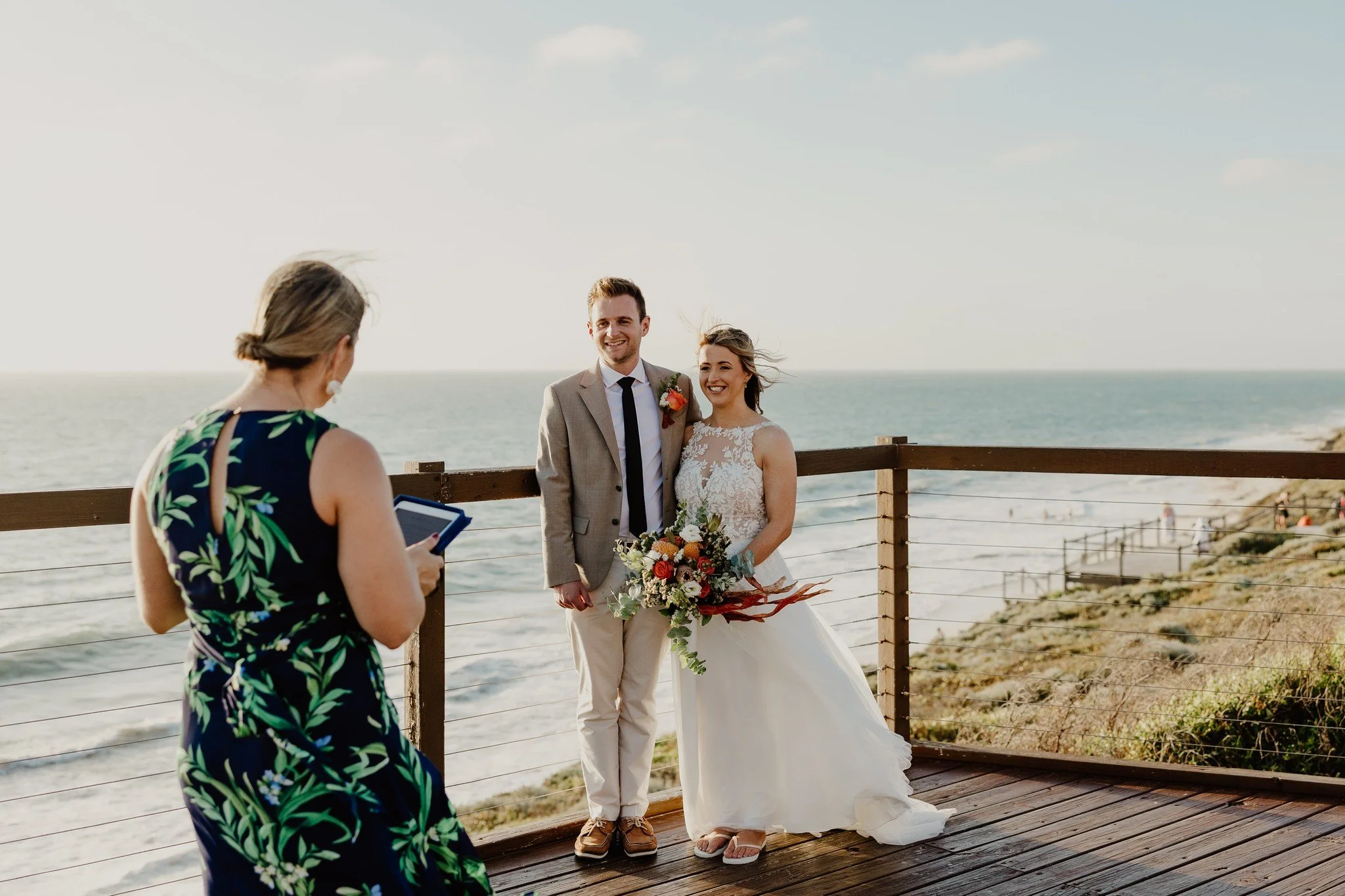 It's around that time of day when our famous sea breeze - the Fremantle Doctor - whips in and takes the heat out of the day.

Eloping in Australia from England, Sophie and Ross were happy to go with the flow when we suggested facing into the wind for