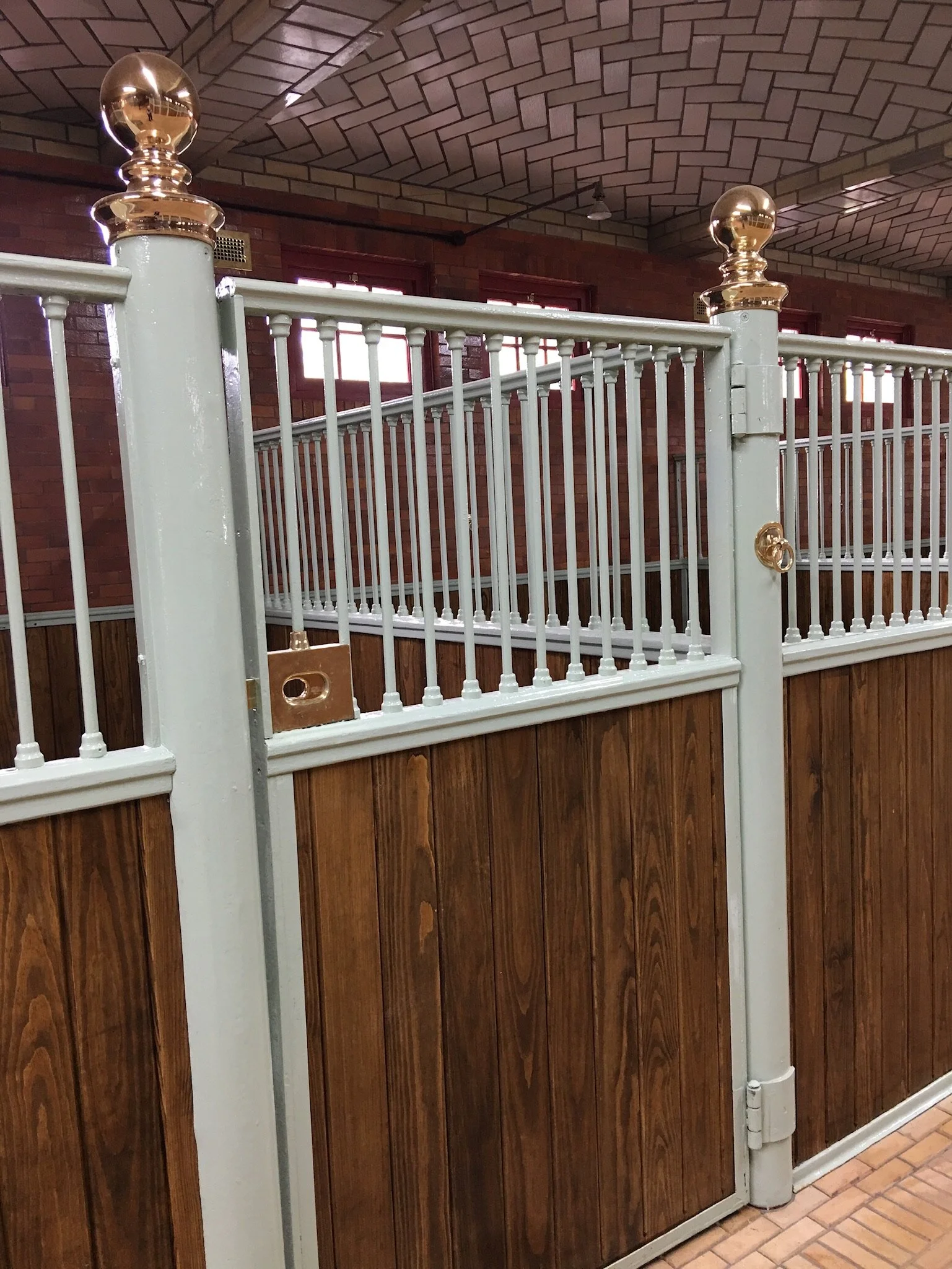 Polished brass hardware on elite horse stable 