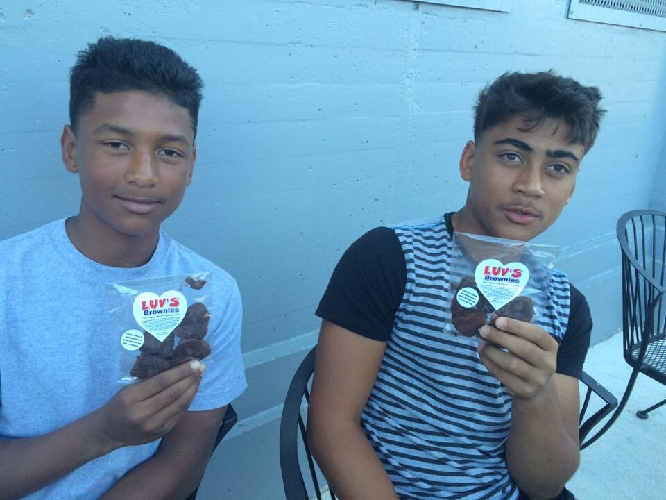 Kids holding heart-shaped brownies at Luv's Brownies 20 year anniversary at San Jose Giants Excite Ballpark (Copy)