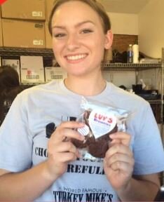 woman holding heart-shaped brownie (Copy)