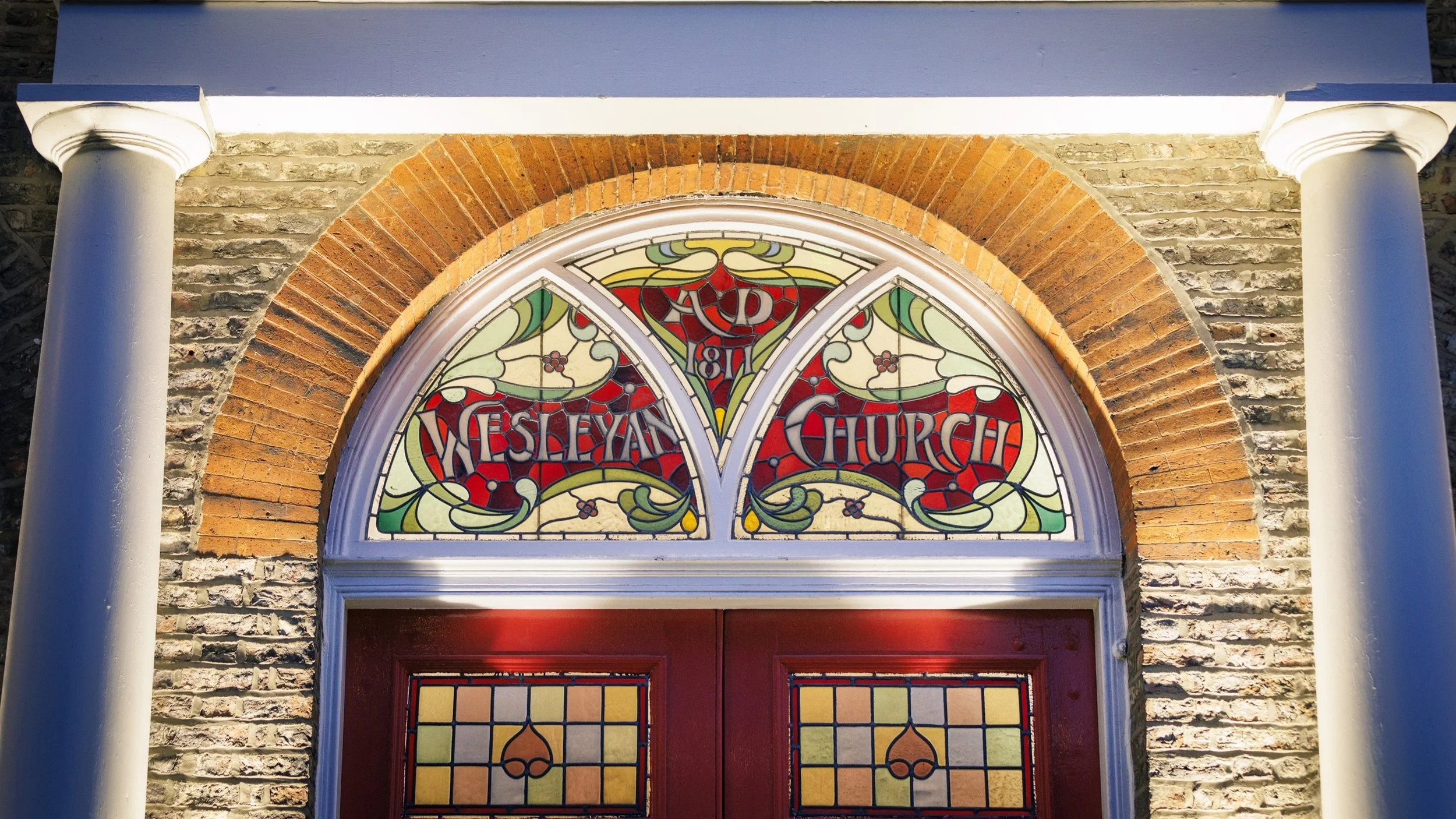 Stained glass windows at the front of the Wesley Centre, previously a Weslyean Chapel in Malton, North Yorkshire