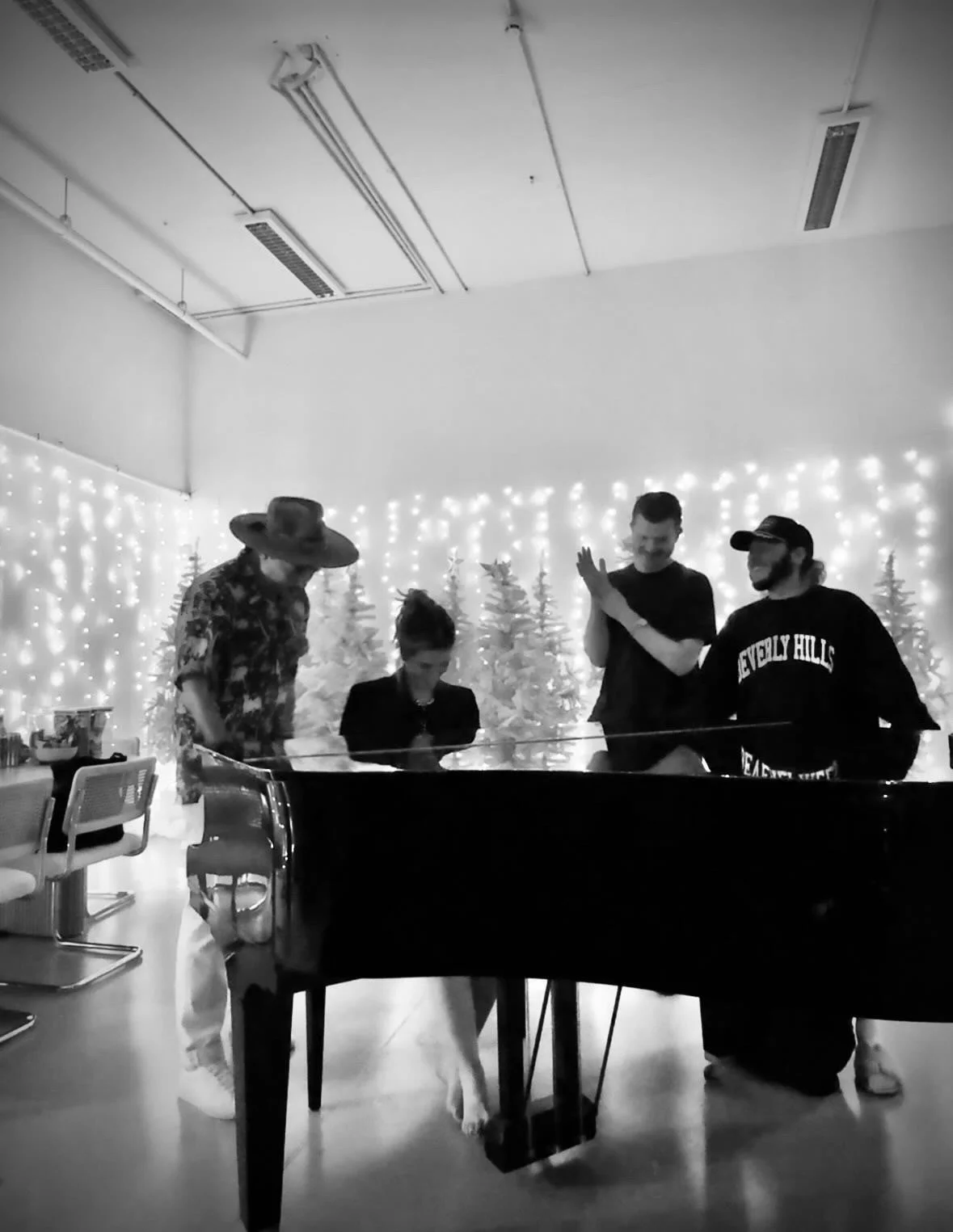 Delta Goodrem and the writers at the grand piano Behind The Scenes from the Eclipse Eurovision Song Contest writing sessions with Jonas Myrin, Ferras Alqaisi and Michael Fatkin