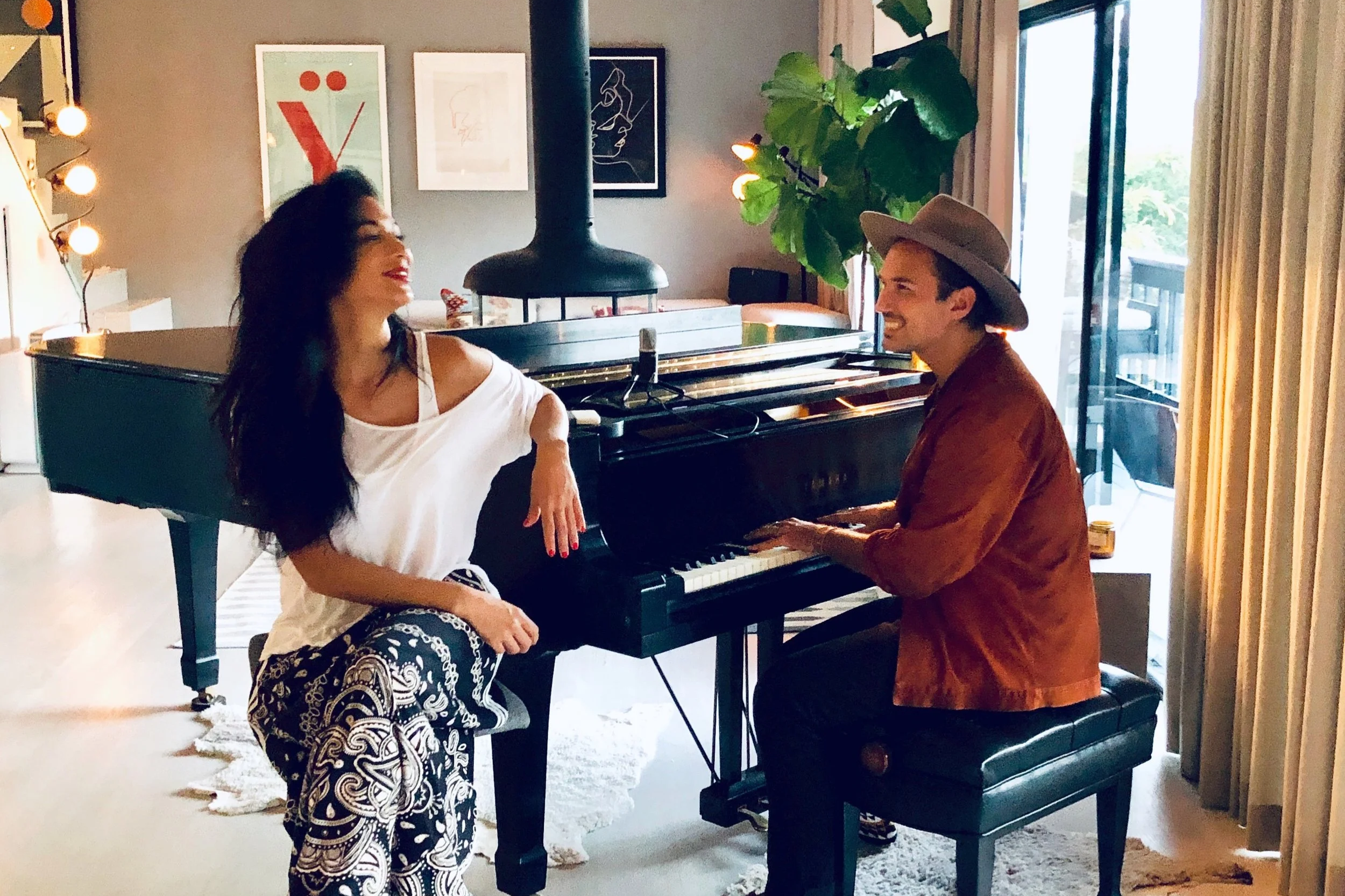 Jonas Myrin and Nicole Scherzinger writing together at Atlas House