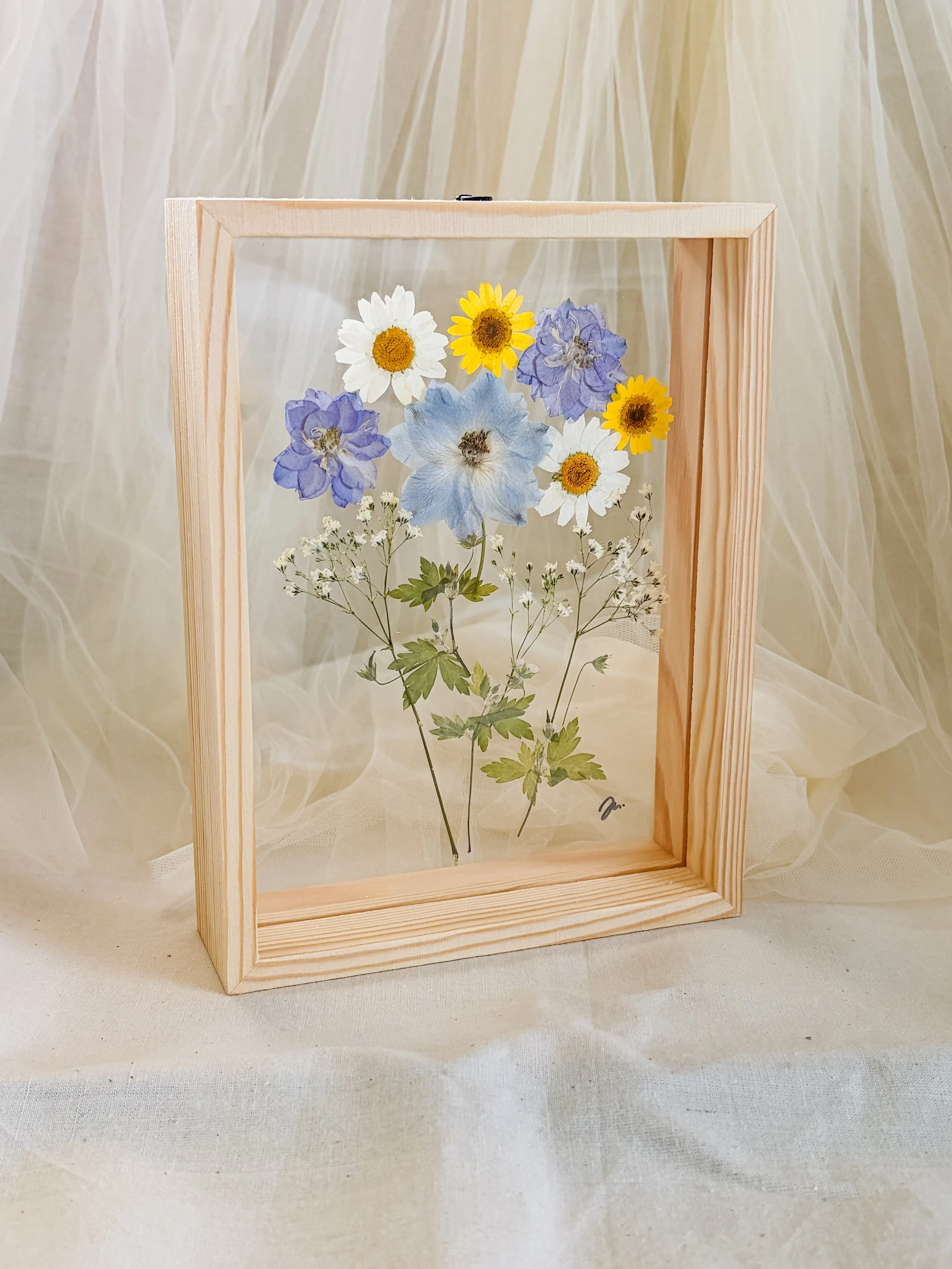 pressed blue flowers and white daisies.JPG