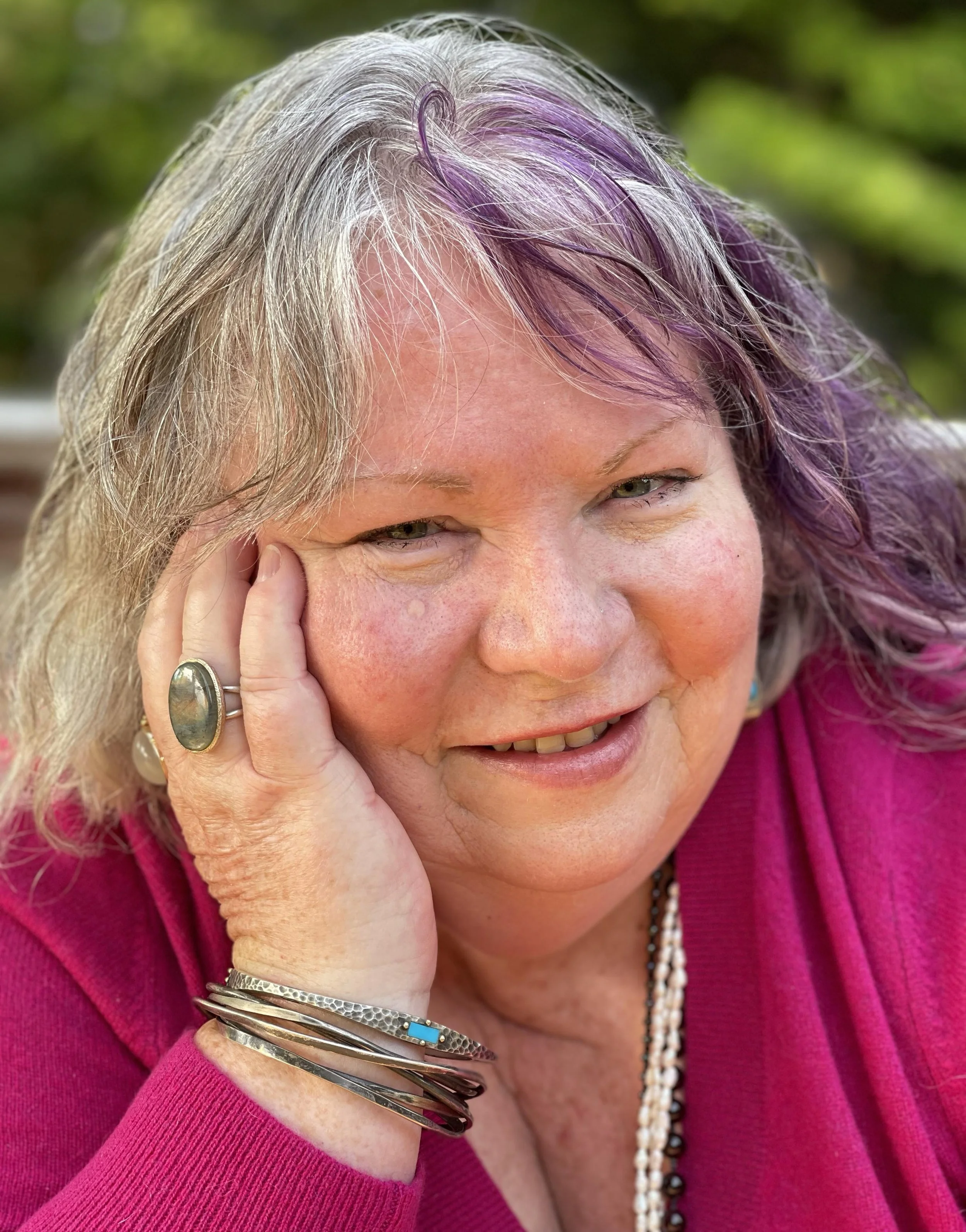 Photo image of Janice Mark in magenta sweater.