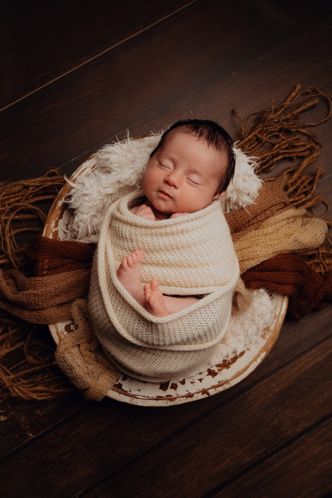 Qu'est-ce que l'emmaillotage durant la séance photo de bébé ?