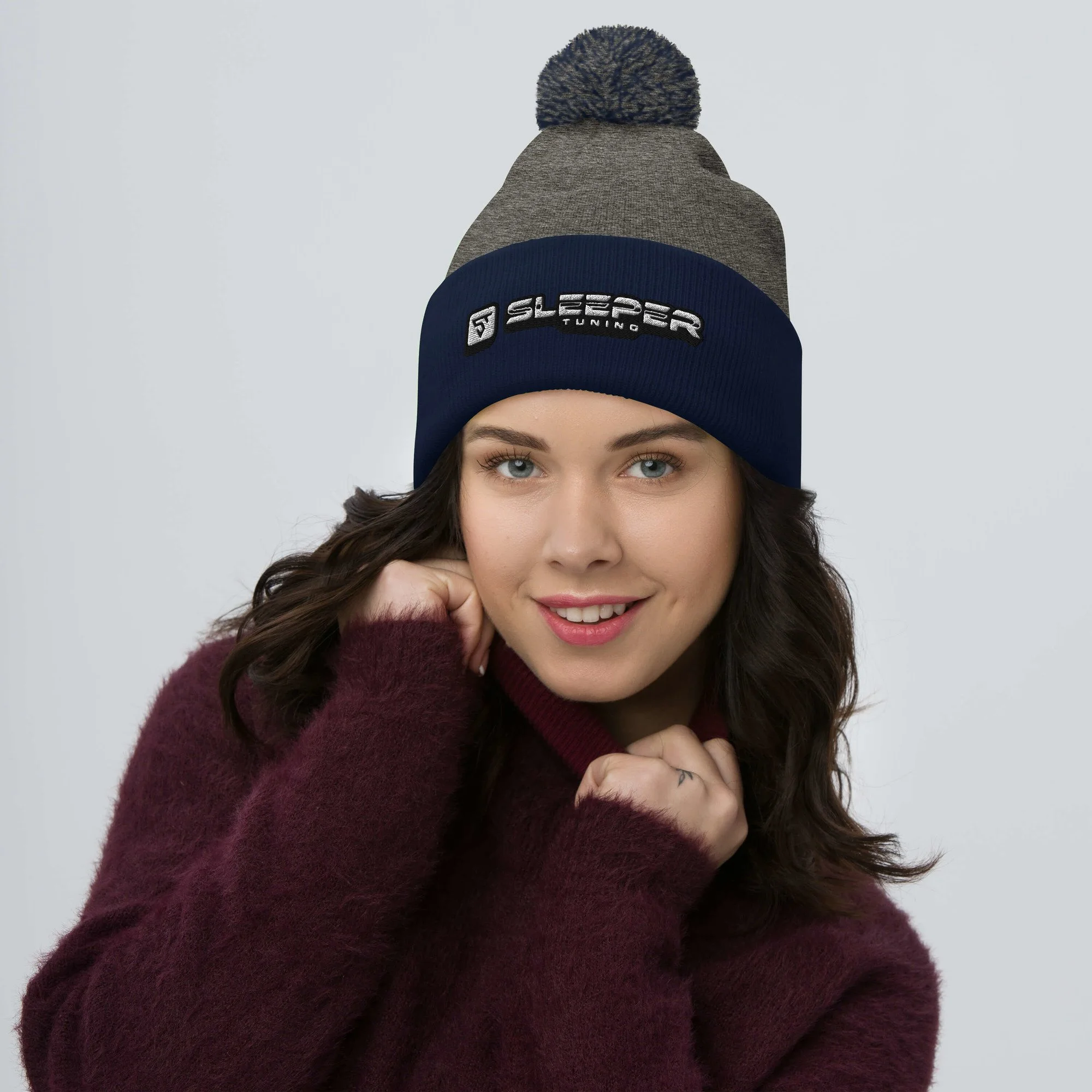 pom-pom-knit-cap-dark-heather-grey-navy-front-68a89b517322a.jpg
